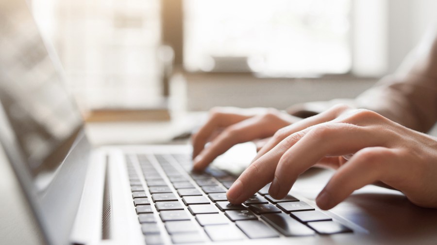 A file image of someone using a computer. (Credit: iStock / Getty Images Plus)