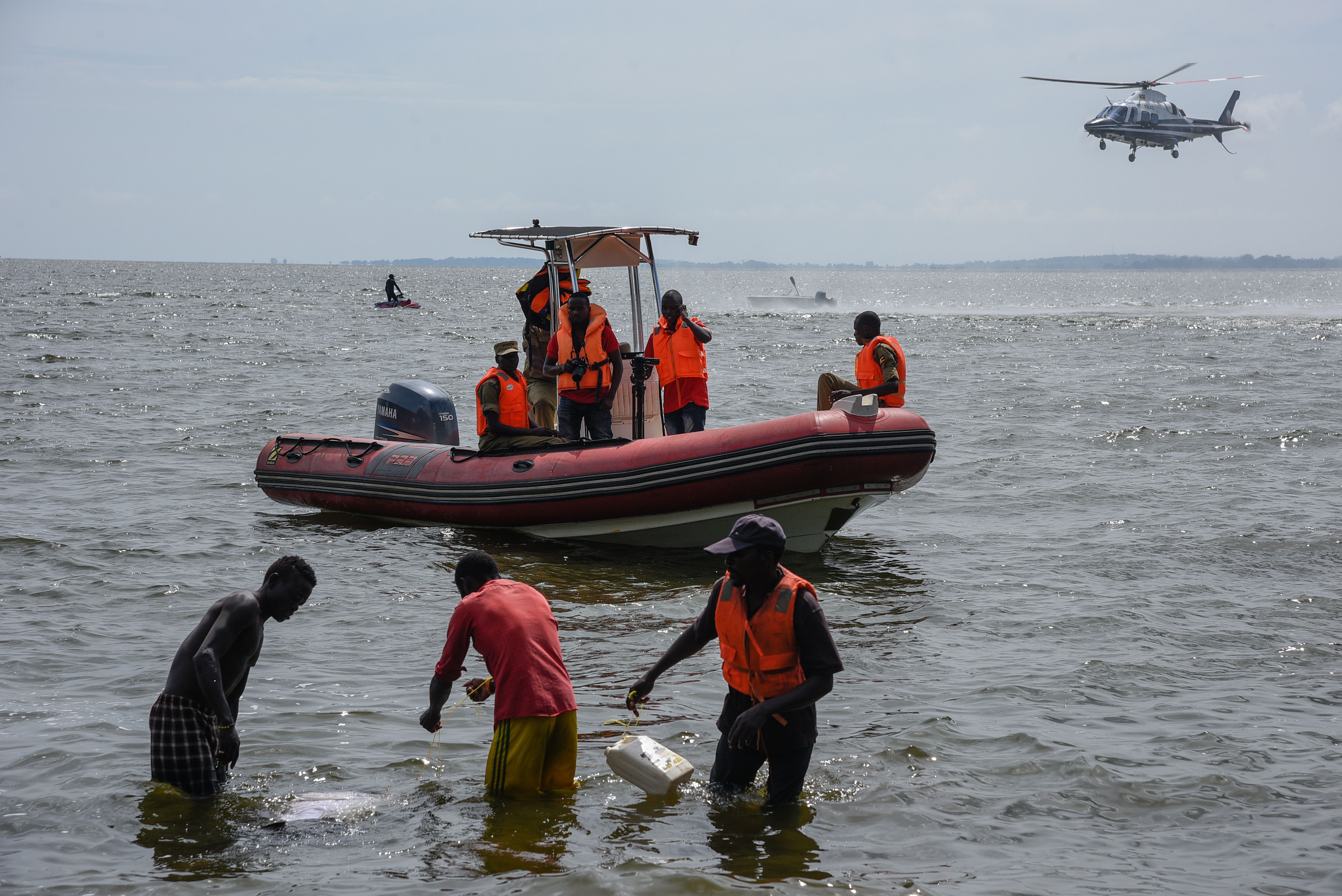 Rescuers search for victims at the site of a capsized cruise boat on Lake Victoria near Mutima village, south of Kampala, Uganda, on November 25, 2018. - Thirty people drowned and more than 60 were feared dead after a pleasure boat sank in Lake Victoria, Ugandan police said, in the latest such incident on Africa's largest body of water. (Credit: Isaac Kasamani/AFP/Getty Images)