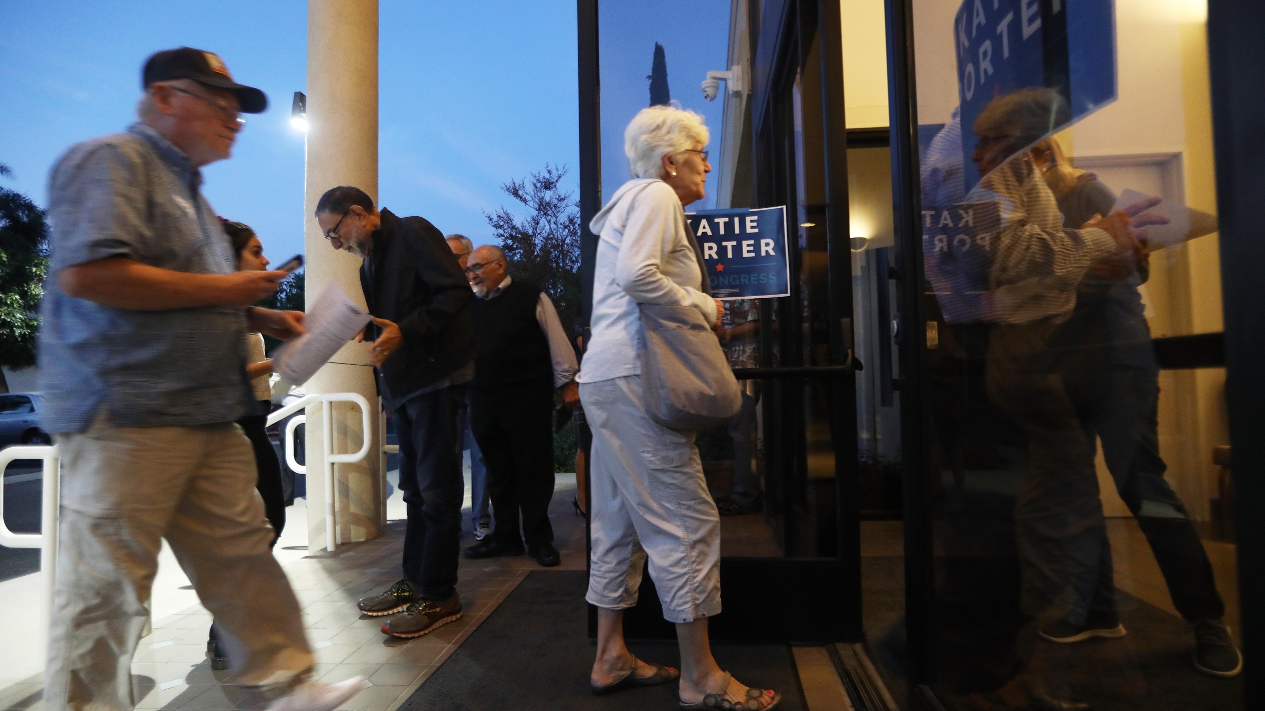 Voters enter before the start of a campaign town hall with Democratic congressional candidate Katie Porter (CA-45) in Tustin on on Oct. 22, 2018. (Credit: Mario Tama/Getty Images)