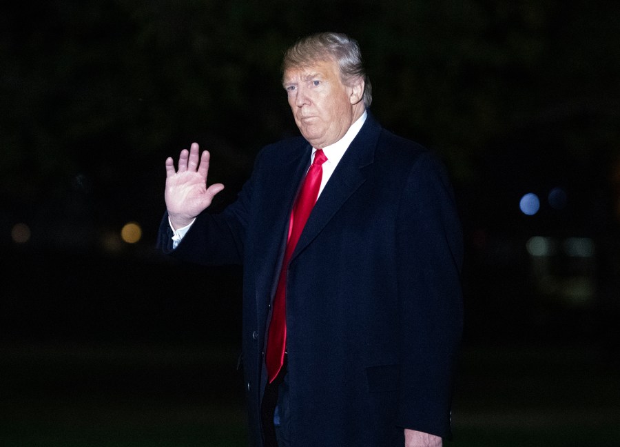 Donald Trump waves to the press pool as he arrives on the South Lawn of the White House after delivering remarks at a Make America Great Again Rally in Estero, Florida on Oct. 31, 2018. (Credit: Ron Sachs-Pool/Getty Images)