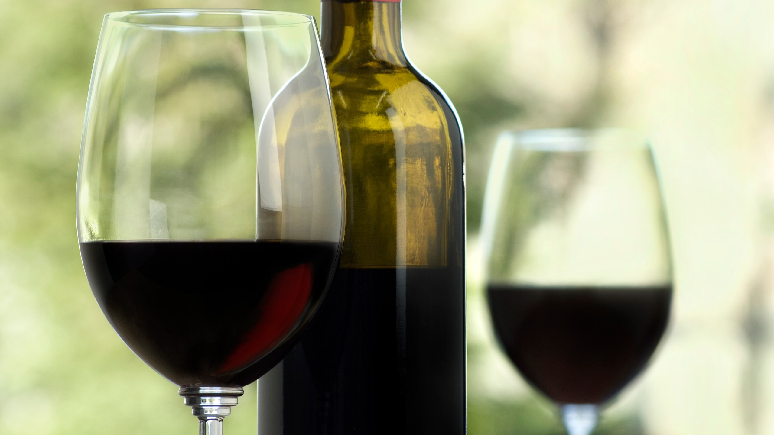 A file photo shows a bottle and two glasses of wine. (Credit: Getty Images)