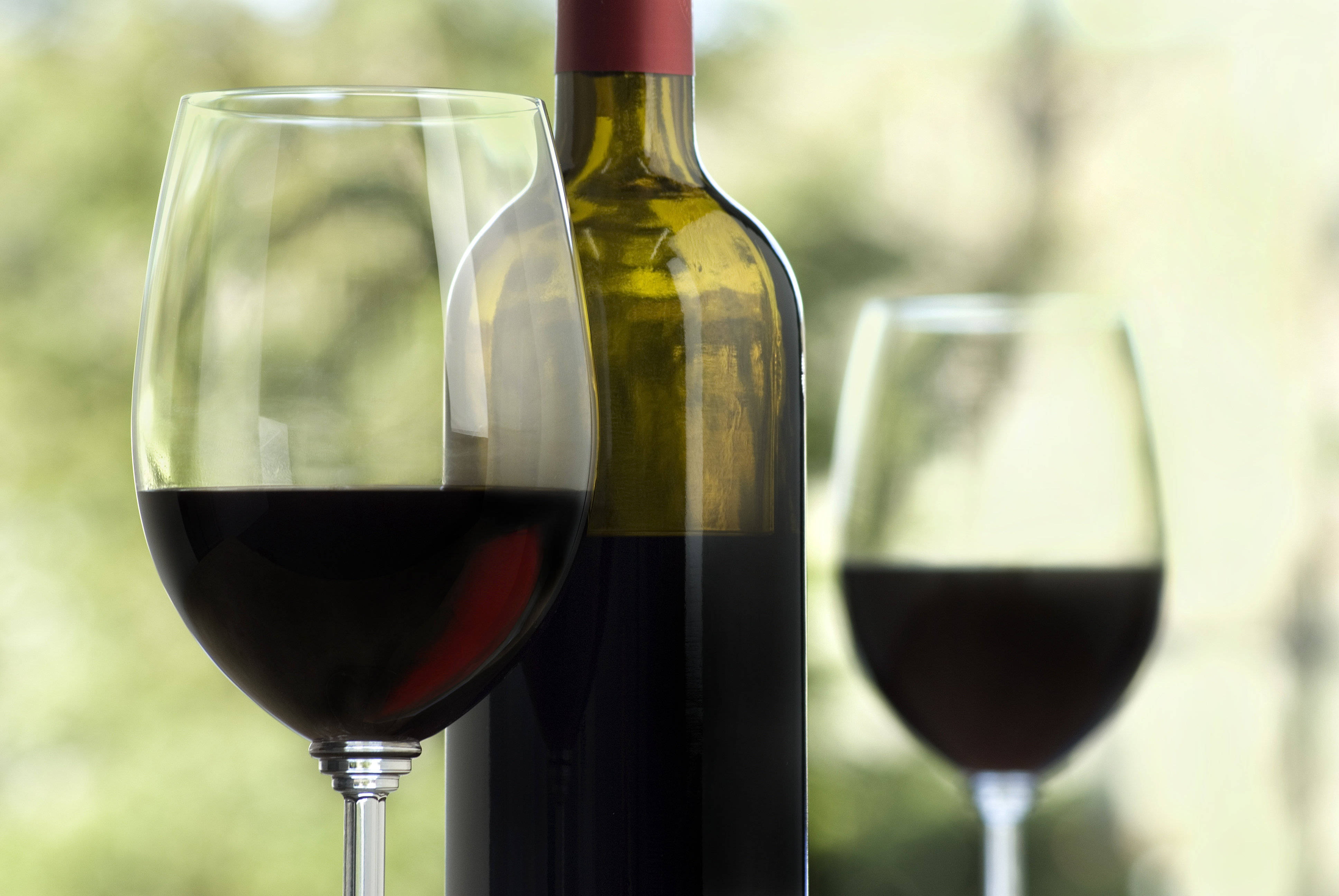 A file photo shows a bottle and two glasses of wine. (Credit: Getty Images)