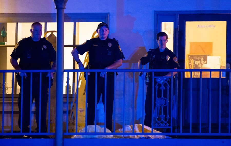 Tallahassee Police officers are stationed outside the HotYoga Studio in Tallahassee, Florida, after a gunman killed one person and injured several others inside on Nov. 2, 2018. (Credit: Mark Wallheiser / Getty Images)