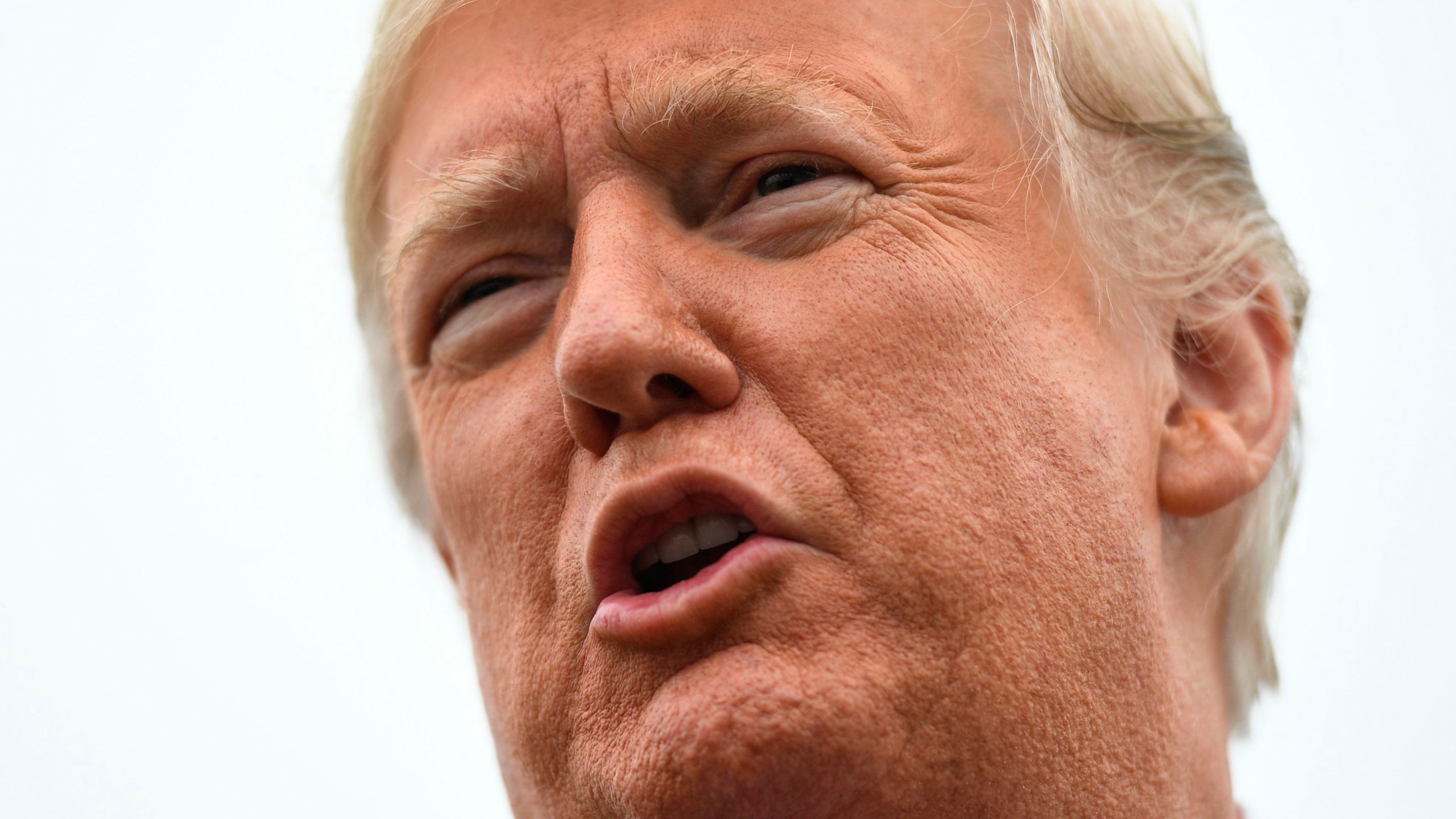 Donald Trump speaks to the press before departing for his first rally stop in Cleveland, Ohio, from Joint Base Andrews, Maryland, on Nov. 5, 2018. (Credit: JIM WATSON/AFP/Getty Images)