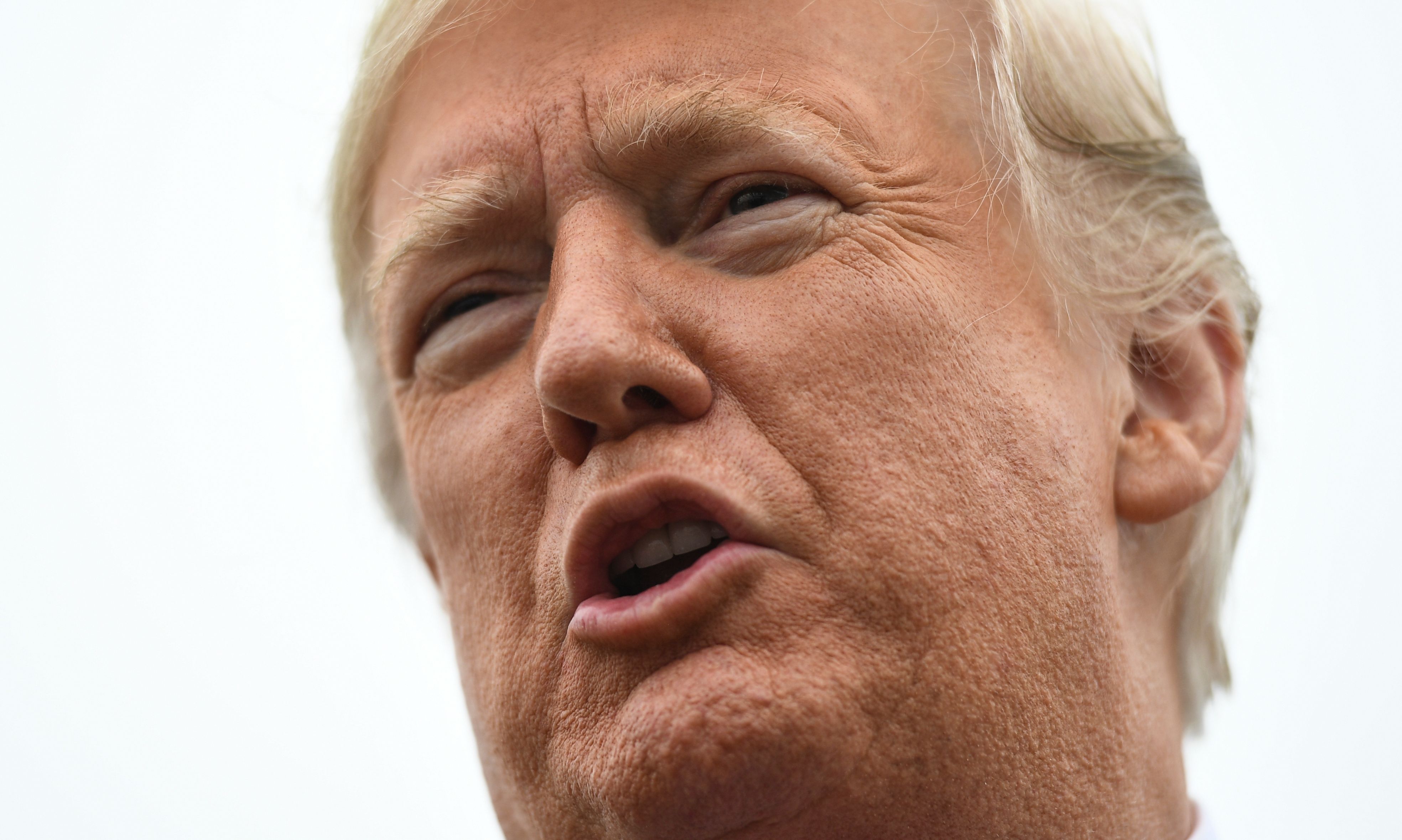 Donald Trump speaks to the press before departing for his first rally stop in Cleveland, Ohio, from Joint Base Andrews, Maryland, on Nov. 5, 2018. (Credit: JIM WATSON/AFP/Getty Images)