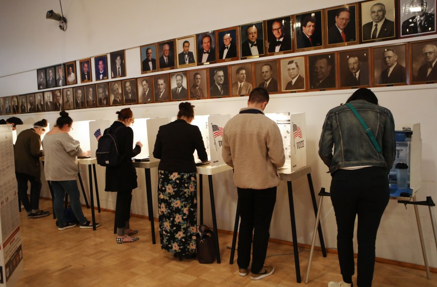 Voters prepare their ballots in the midterm elections at a polling place at a Masonic Lodge on Nov. 6, 2018, in Los Angeles. (Credit: Mario Tama/Getty Images)