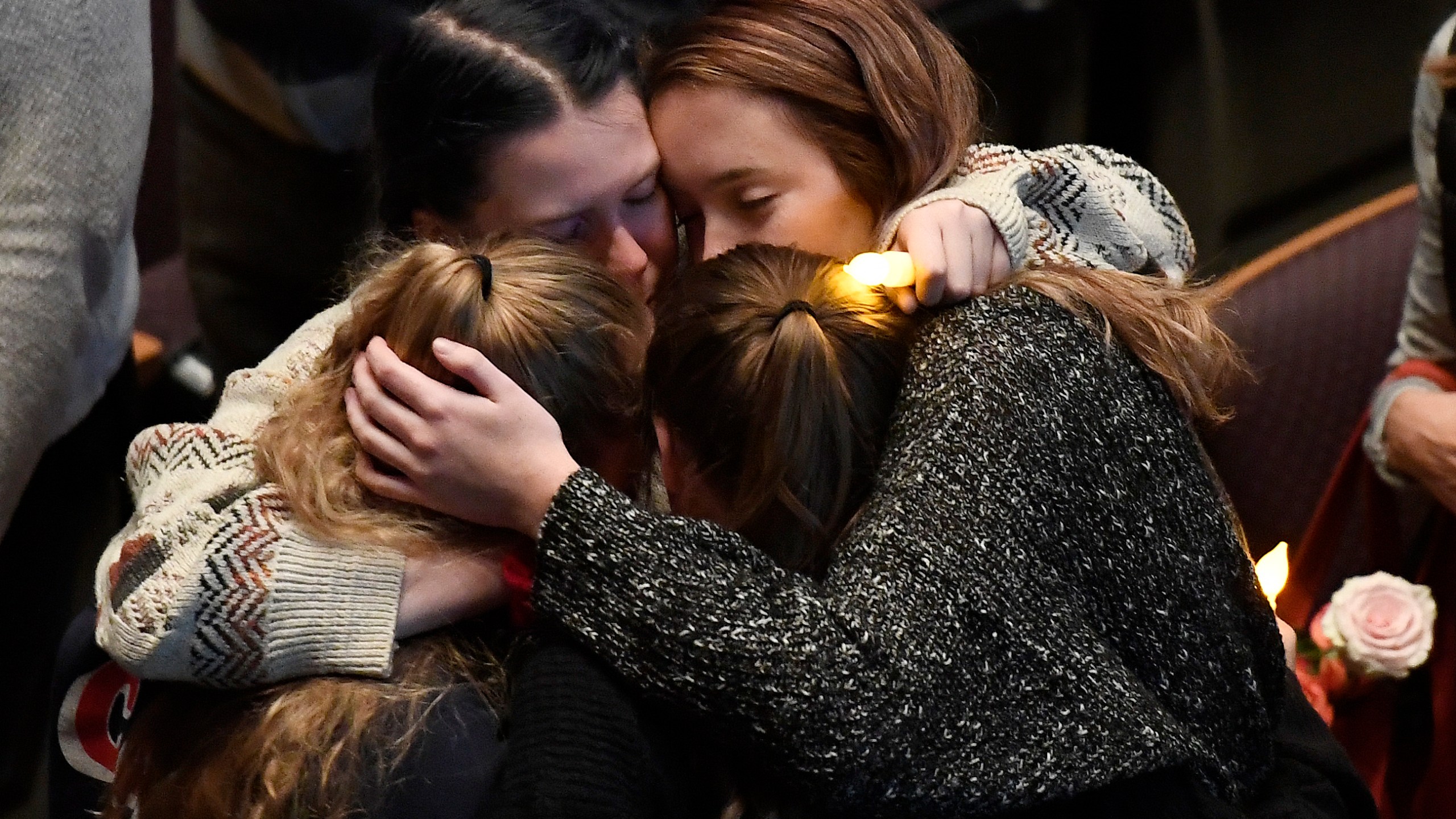 Mourners cry and comfort each other during a vigil for the victims of the mass shooting at the Thousand Oaks Civic Arts Plaza on Nov. 8, 2018, in Thousand Oaks. (Credit: Kevork Djansezian/Getty Images)