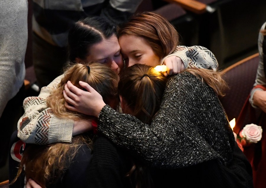 Mourners cry and comfort each other during a vigil for the victims of the mass shooting at the Thousand Oaks Civic Arts Plaza on Nov. 8, 2018, in Thousand Oaks. (Credit: Kevork Djansezian/Getty Images)