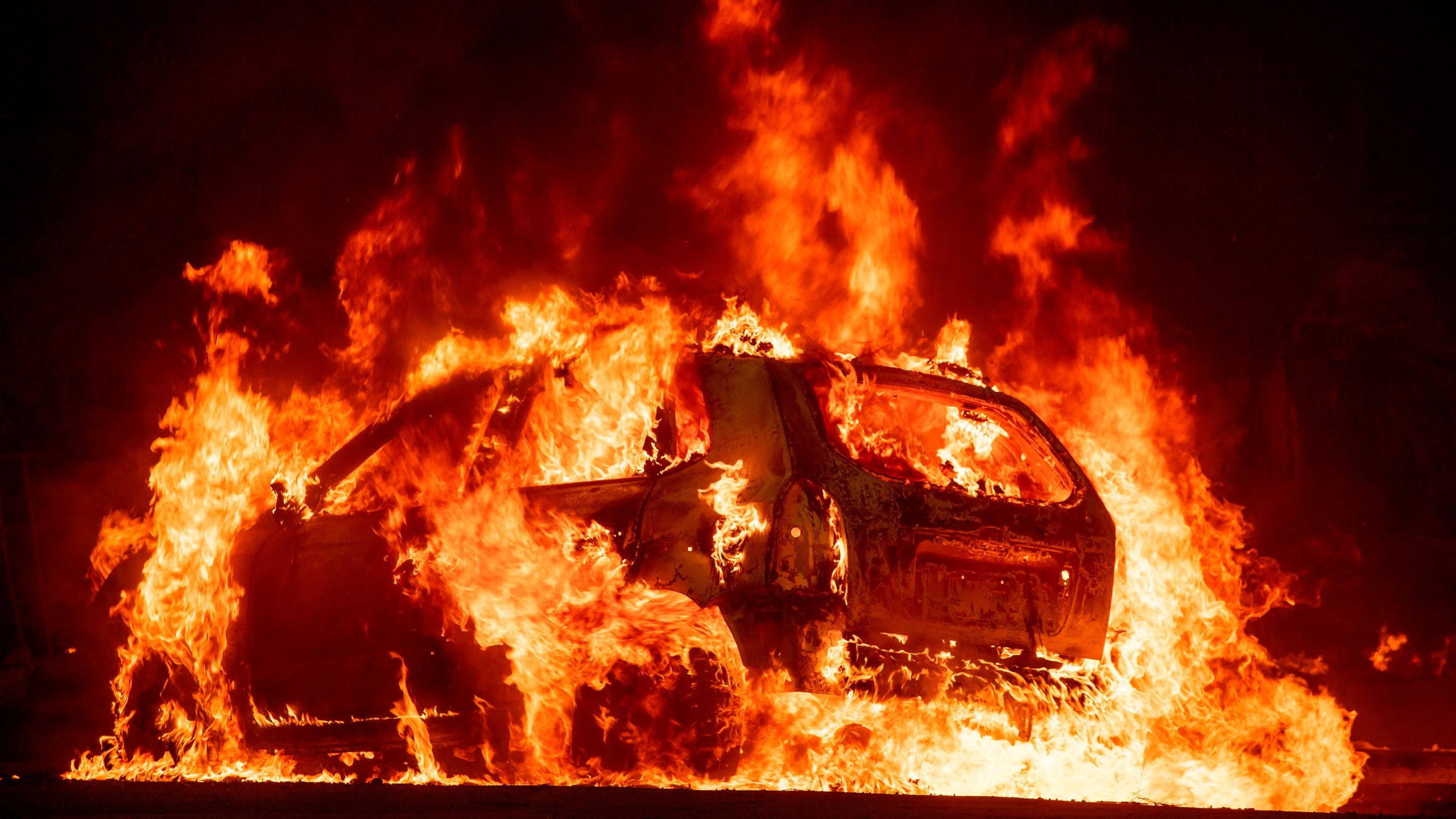 A car explodes into flames as the Camp Fire tears through downtown Paradise, California, on Nov. 8, 2018. (Credit: JOSH EDELSON/AFP/Getty Images)