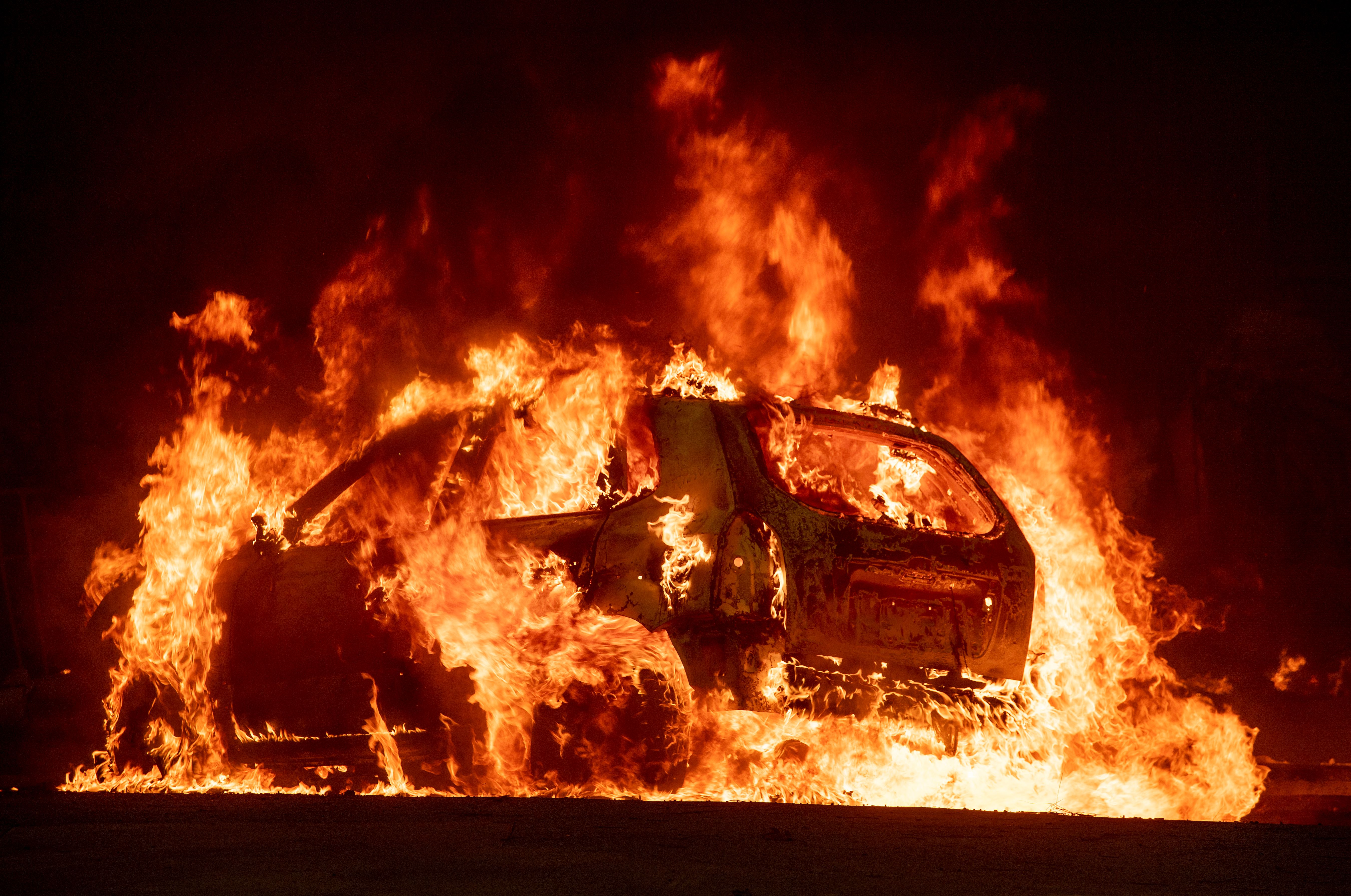 A car explodes into flames as the Camp Fire tears through downtown Paradise, California, on Nov. 8, 2018. (Credit: JOSH EDELSON/AFP/Getty Images)