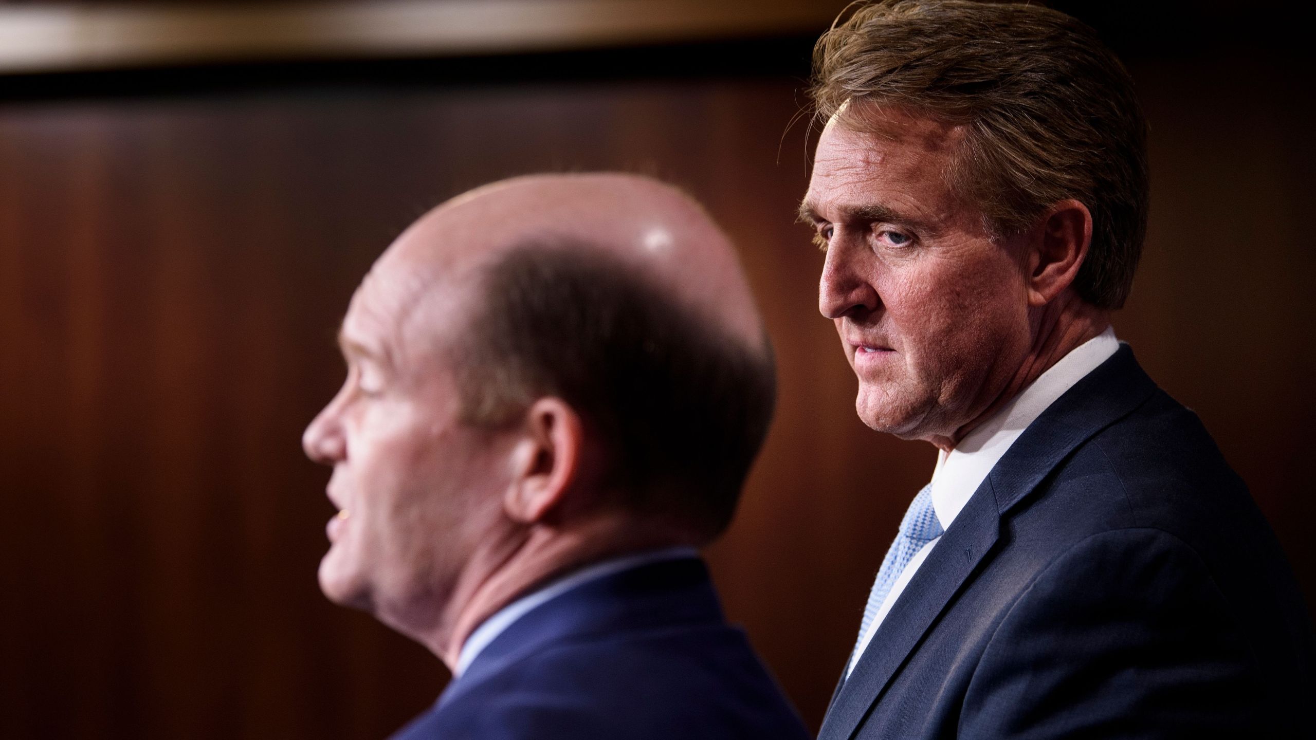 Sen. Jeff Flake (R-AZ), right, and Sen. Christopher A. Coons (D-DE) hold a press conference on legislation to protect the Mueller Investigation on Capitol Hill Nov. 14, 2018. (Credit: BRENDAN SMIALOWSKI/AFP/Getty Images)