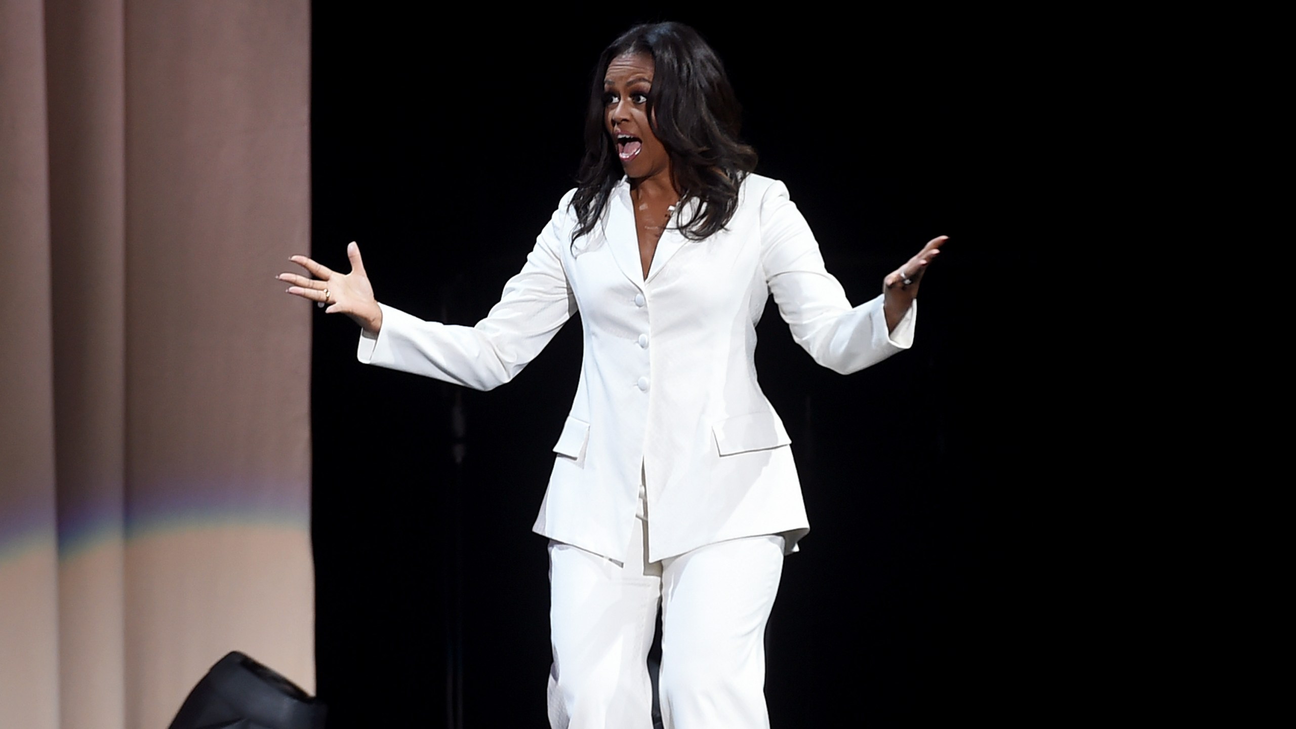 Former first lady and author Michelle Obama appears onstage at "Becoming: An Intimate Conversation with Michelle Obama" at the Forum on Nov. 15, 2018, in Inglewood, California. (Credit: Kevin Winter/Getty Images)