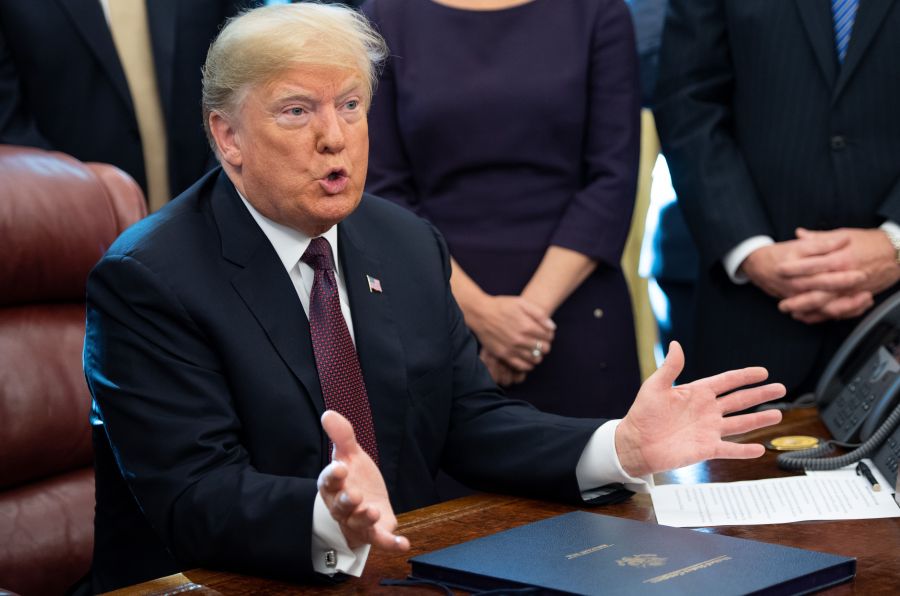 President Donald Trump speaks after signing the Cybersecurity and Infrastructure Security Agency Act in the Oval Office of the White House on Nov. 16, 2018. (Credit: Saul Loeb / AFP / Getty Images)