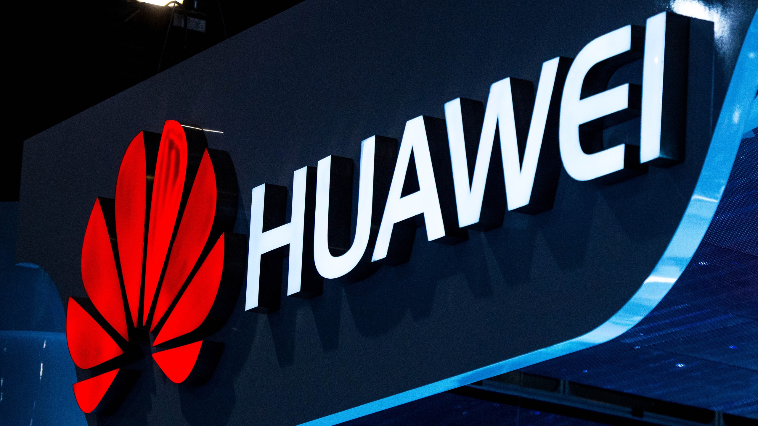 A logo sits illuminated outside the Huawei pavilion during the second day of the Mobile World Congress 2015 at the Fira Gran Via complex on March 3, 2015. (Credit: David Ramos/Getty Images)