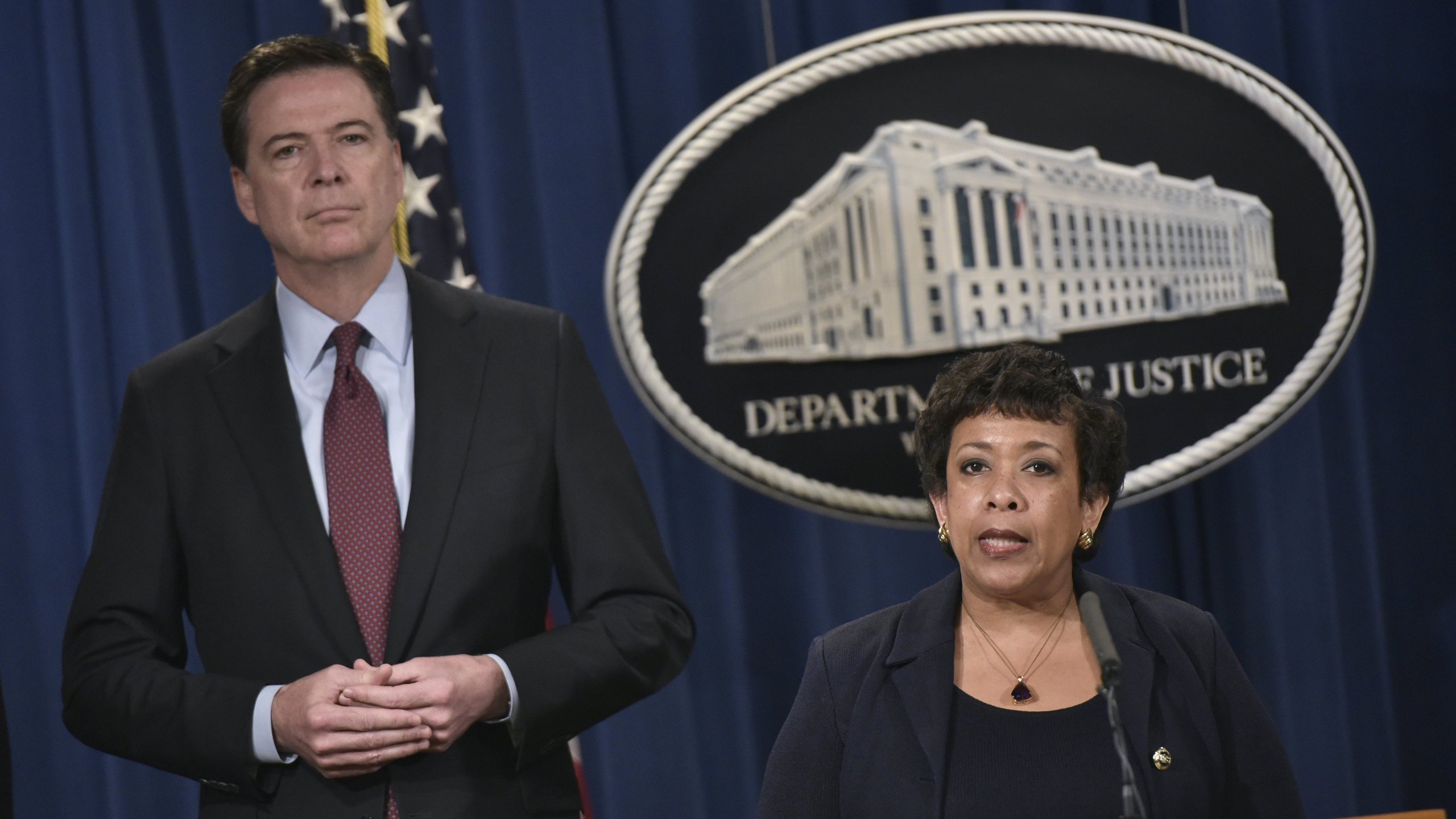 Loretta Lynch speaks during a press conference while James Comey listens at the Department of Justice on March 24, 2016 in Washington, D.C. (Credit: MANDEL NGAN/AFP/Getty Images)