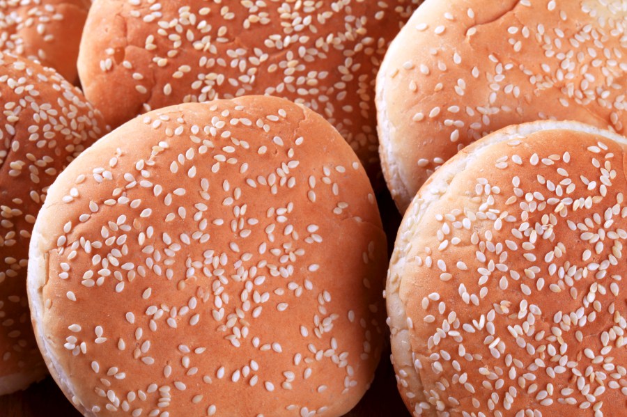 Hamburger buns with sesame seeds on top are seen in this file photo. (Credit: iStock/Getty Images Plus)