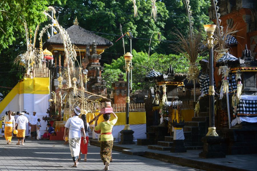 Balinese Hindus arrive for prayers to celebrate the religous festival Galungan at the Jagat Natha temple in Denpasar on Indonesia's Bali island on Nov. 1, 2017. (Credit: SONNY TUMBELAKA/AFP/Getty Images)