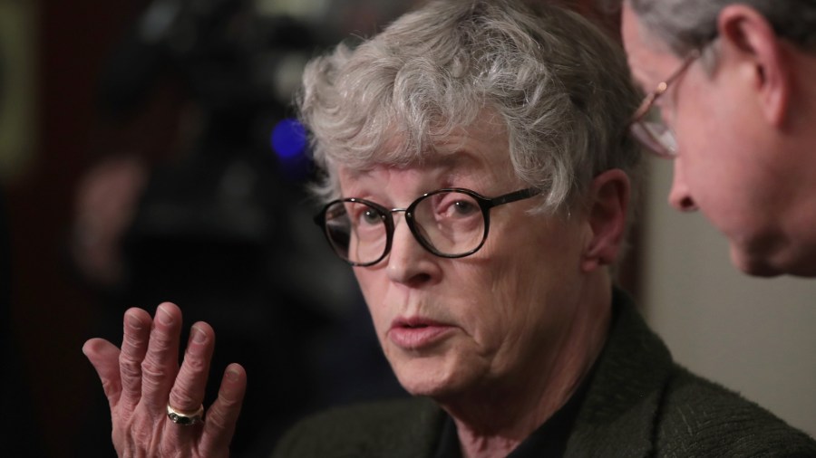 Former Michigan State University President Lou Anna Simon answers a question after being confronted by former MSU gymnast Lidsey Lemke during a break in the sentencing hearing for Larry Nassar who has been accused of molesting more than 100 girls while he was a physician for USA Gymnastics and Michigan State University where he had his sports-medicine practice on Jan. 17, 2018, in Lansing, Michigan. At the time, she was president of the university. (Credit: Scott Olson/Getty Images)