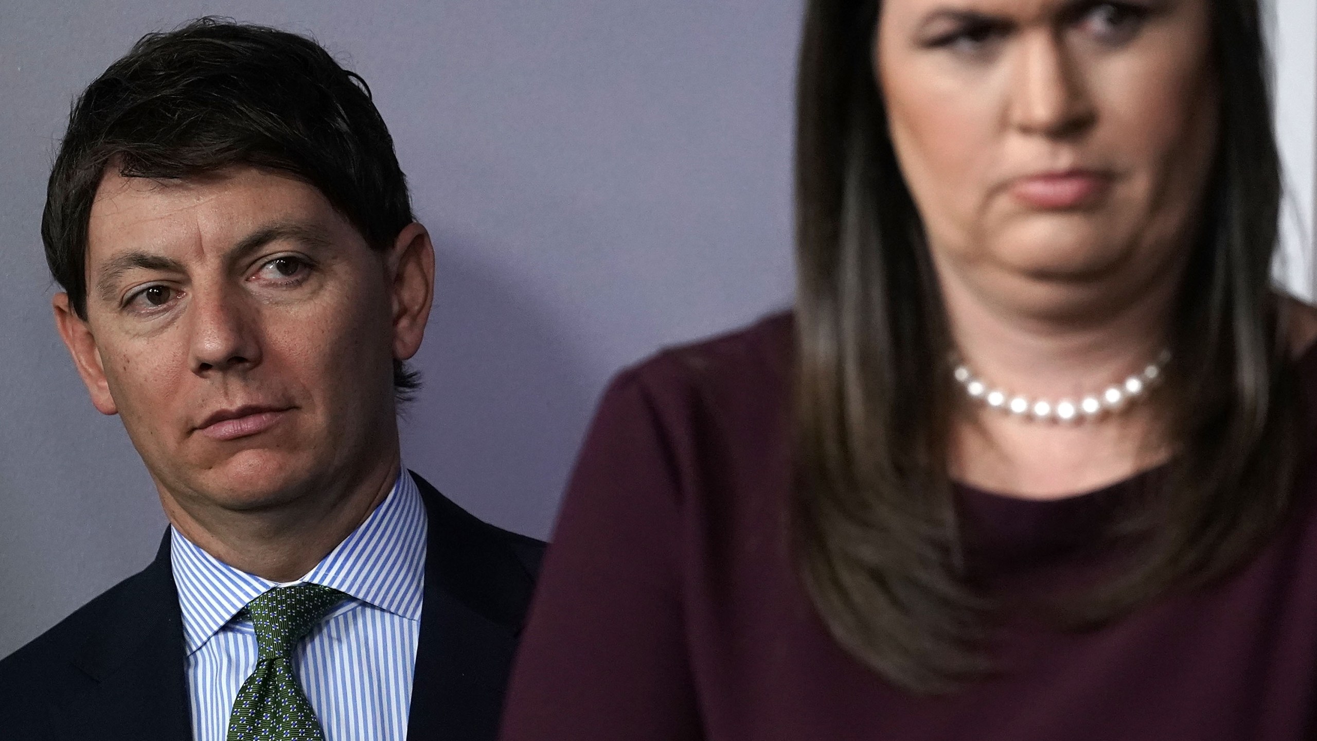 White House Press Secretary Sarah Sanders, right, and White House Deputy Press Secretary Hogan Gidley listen during a White House news briefing on Oct. 3, 2018. (Credit: Alex Wong/Getty Images)