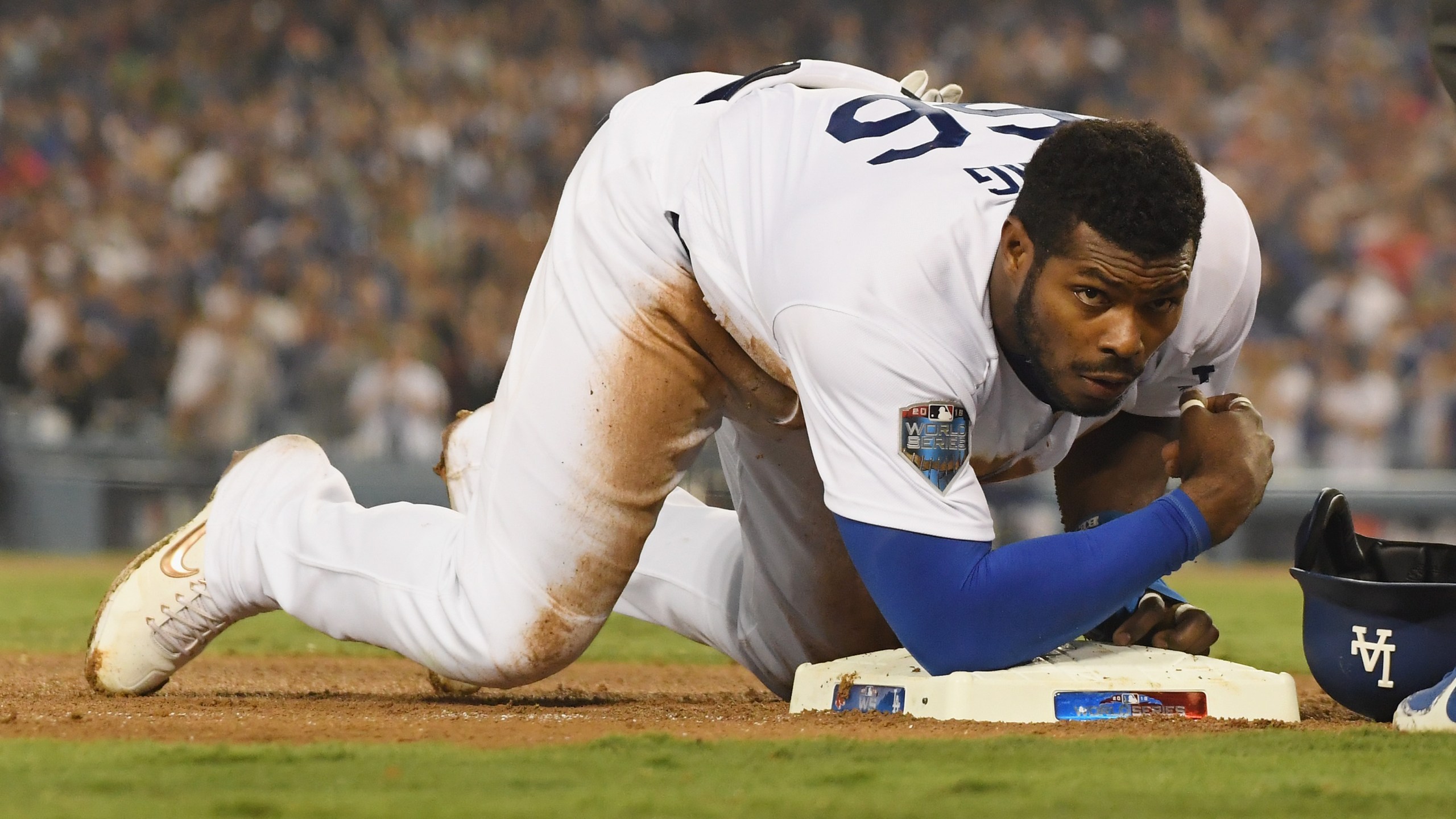 Yasiel Puig of the Los Angeles Dodgers slides safely into third base during Game Four of the 2018 World Series against the Boston Red Sox at Dodger Stadium on Oct. 27, 2018. (Credit: Harry How / Getty Images)