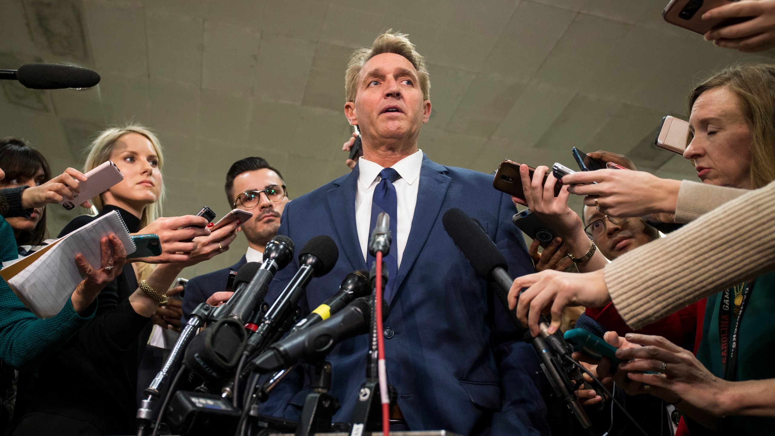 Sen. Jeff Flake (R-AZ) speaks to the press after receiving a briefing from U.S. Secretary of Defense Jim Mattis and U.S. Secretary of State Mike Pompeo on developments in Saudi Arabia on Nov. 28, 2018. (Credit: Zach Gibson/Getty Images)