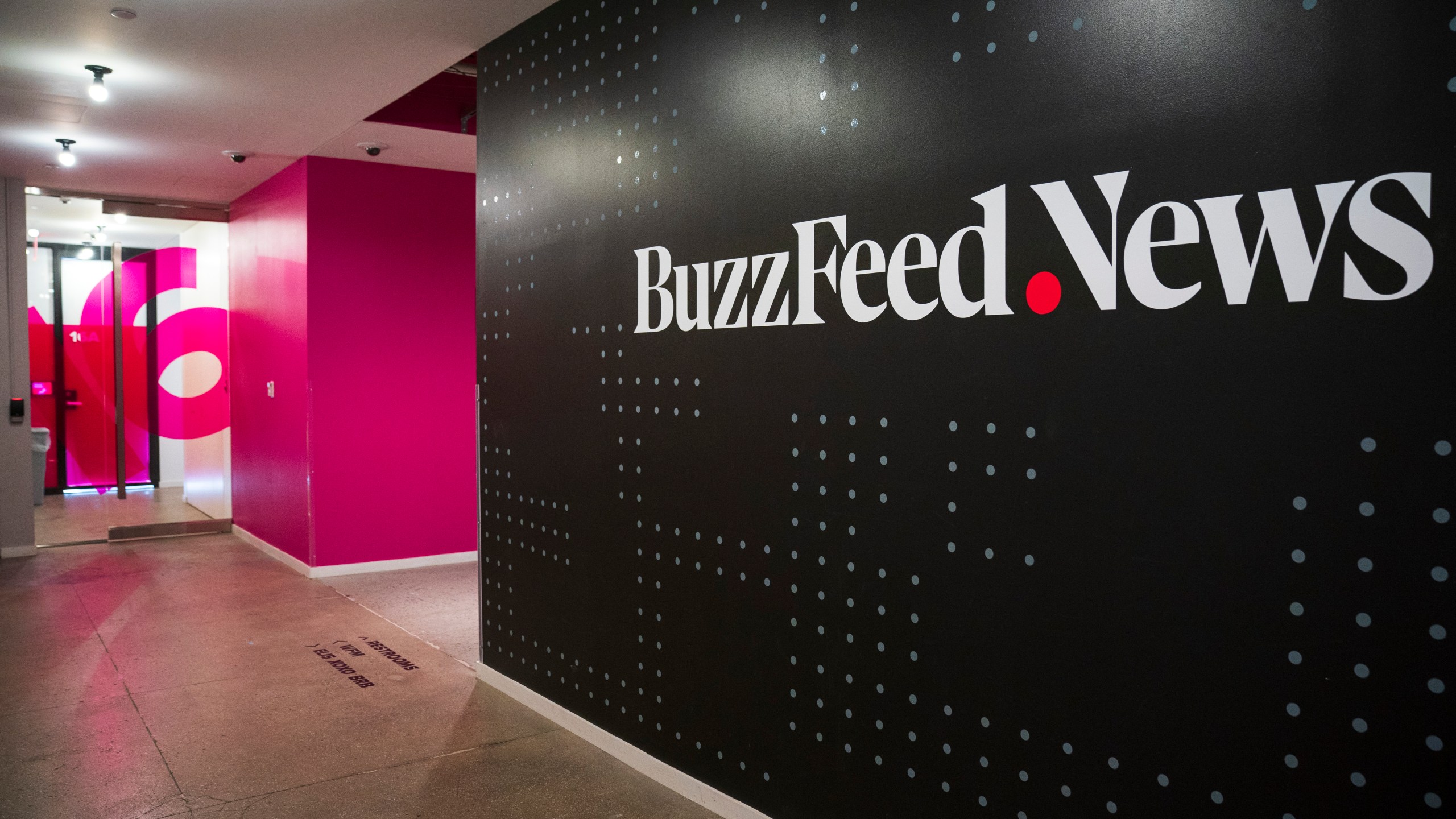 A BuzzFeed News logo adorns a wall inside BuzzFeed headquarters on Dec. 11, 2018 in New York City. (Credit: Drew Angerer/Getty Images)