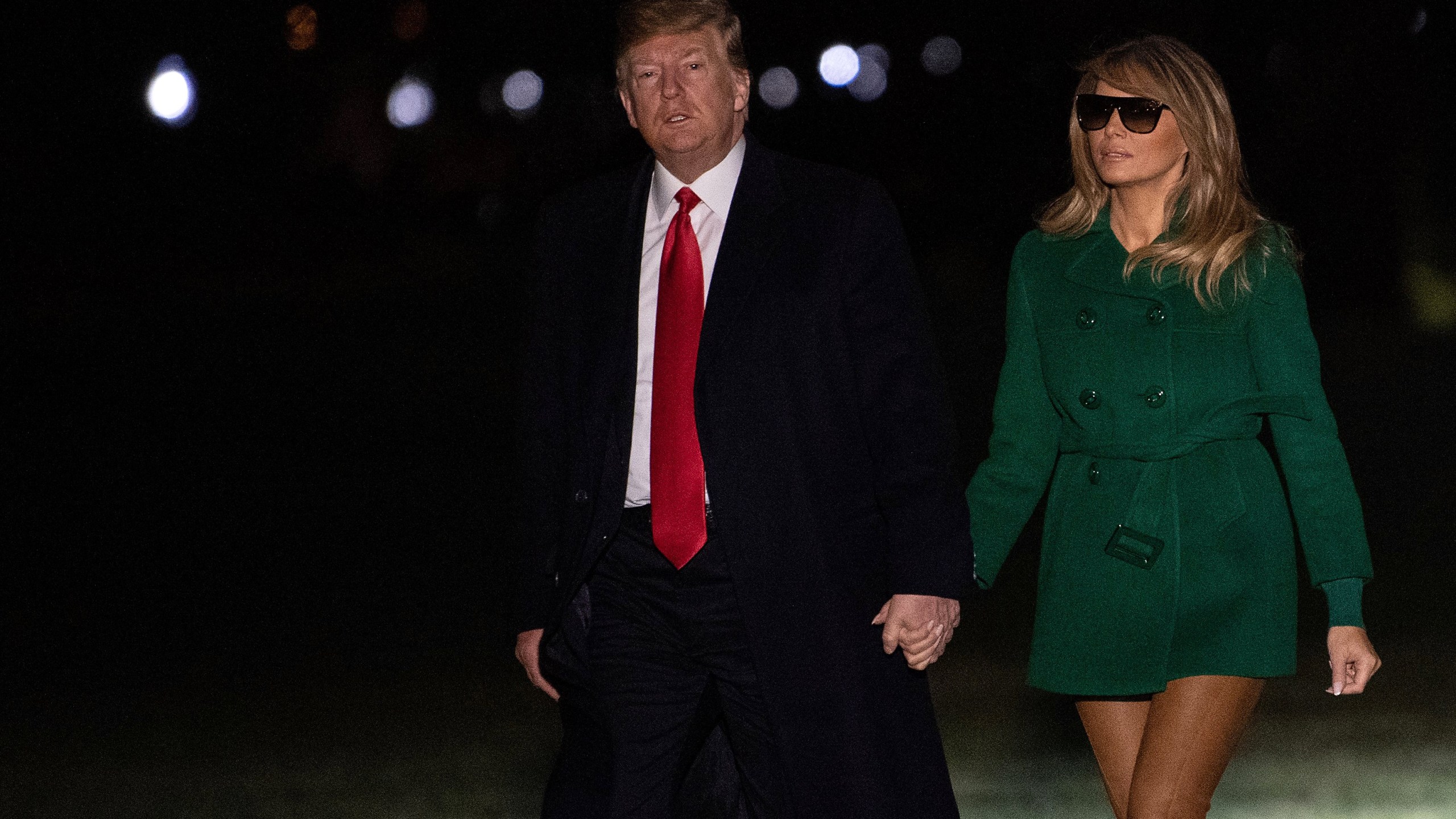 US President Donald Trump and First Lady Melania Trump arrive at the White House in Washington, DC, on December 27, 2018, as they return from an unannounced trip to Iraq. (Credit: NICHOLAS KAMM/AFP/Getty Images)