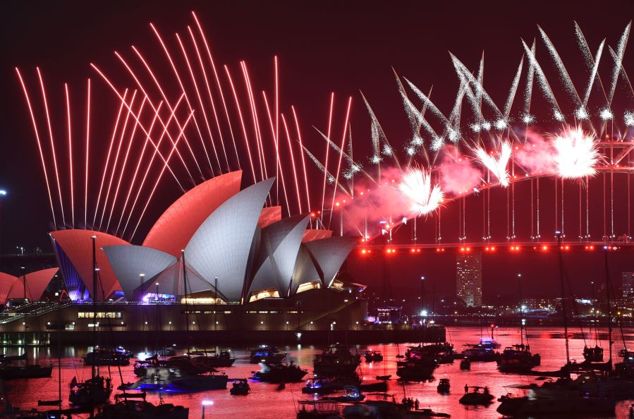 New Year's Eve fireworks erupt over Sydney's iconic Harbour Bridge and Opera House during the fireworks show on January 1, 2019. (Credit: PETER PARKS/AFP/Getty Images)