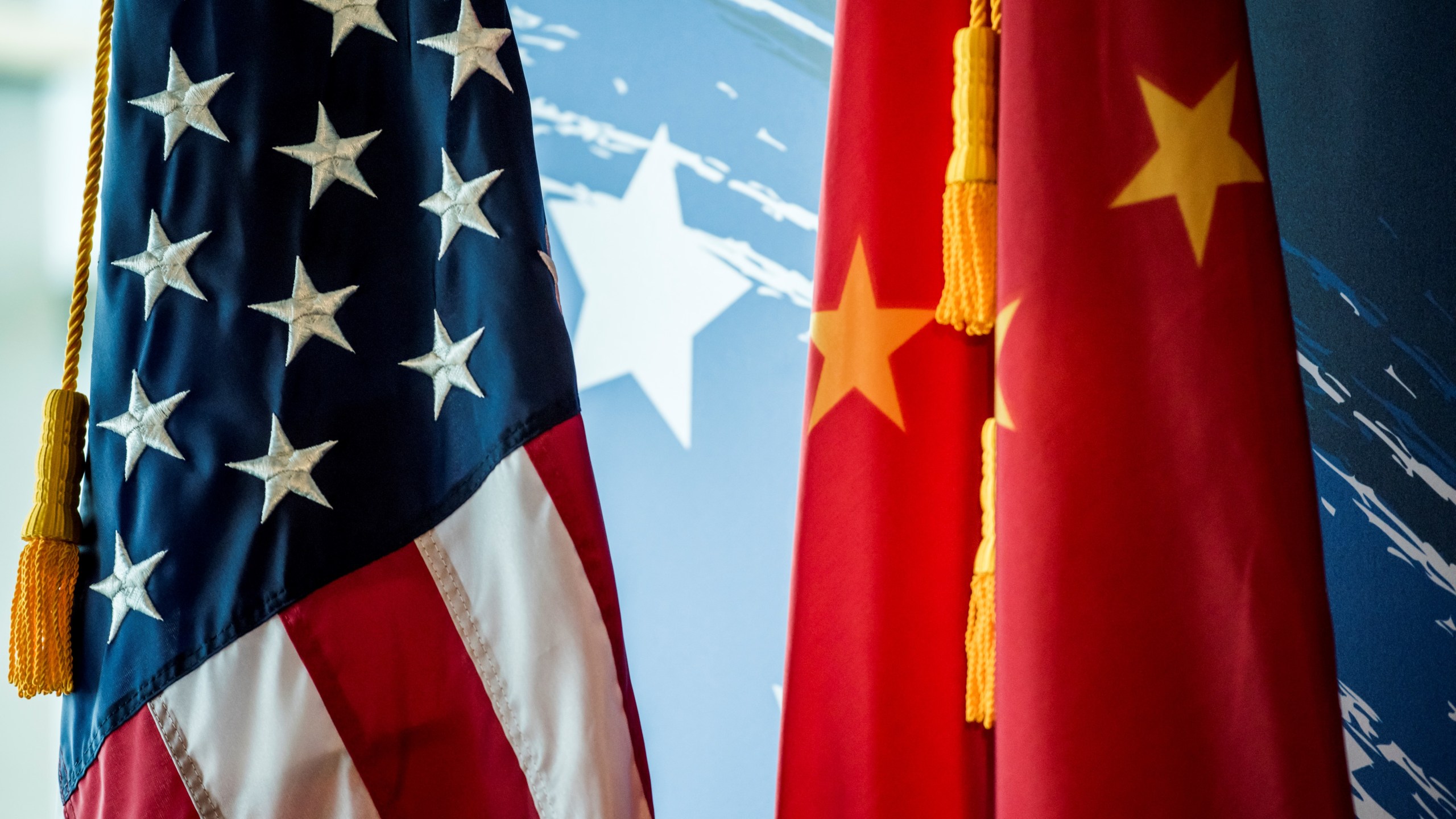 The Chinese and US national flags are seen during a promotional event in Beijing on June 30, 2017. (Credit: FRED DUFOUR/AFP/Getty Images)