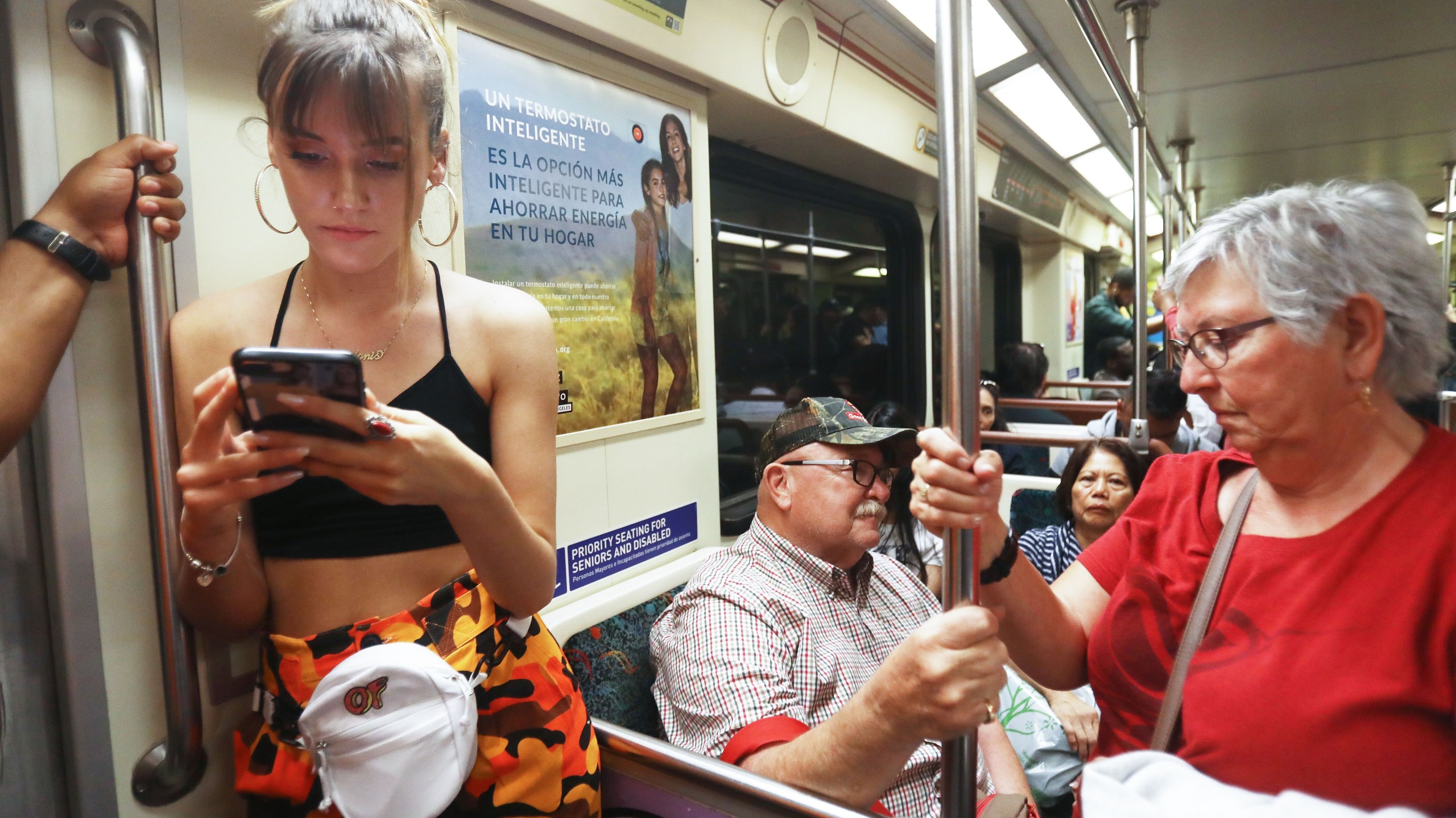 People ride an L.A. County Metro train on March 28, 2018. (Credit: Mario Tama / Getty Images)