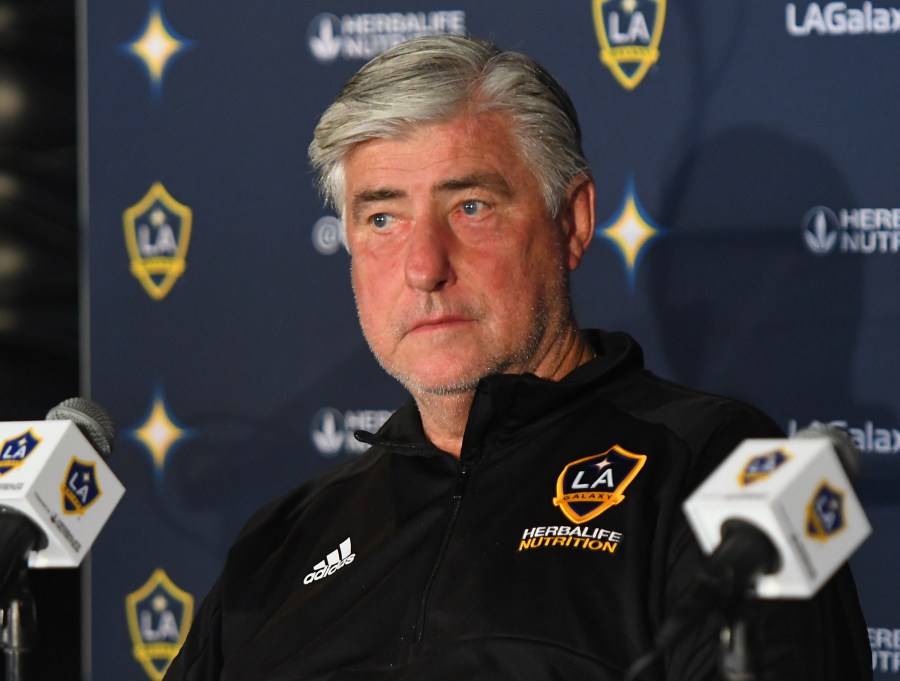 Sigi Schmid of the Los Angeles Galaxy listens as Zlatan Ibrahimovic #9 speaks during a press conference at StubHub Center on March 30, 2018 in Carson. (Credit: Jayne Kamin-Oncea/Getty Images)