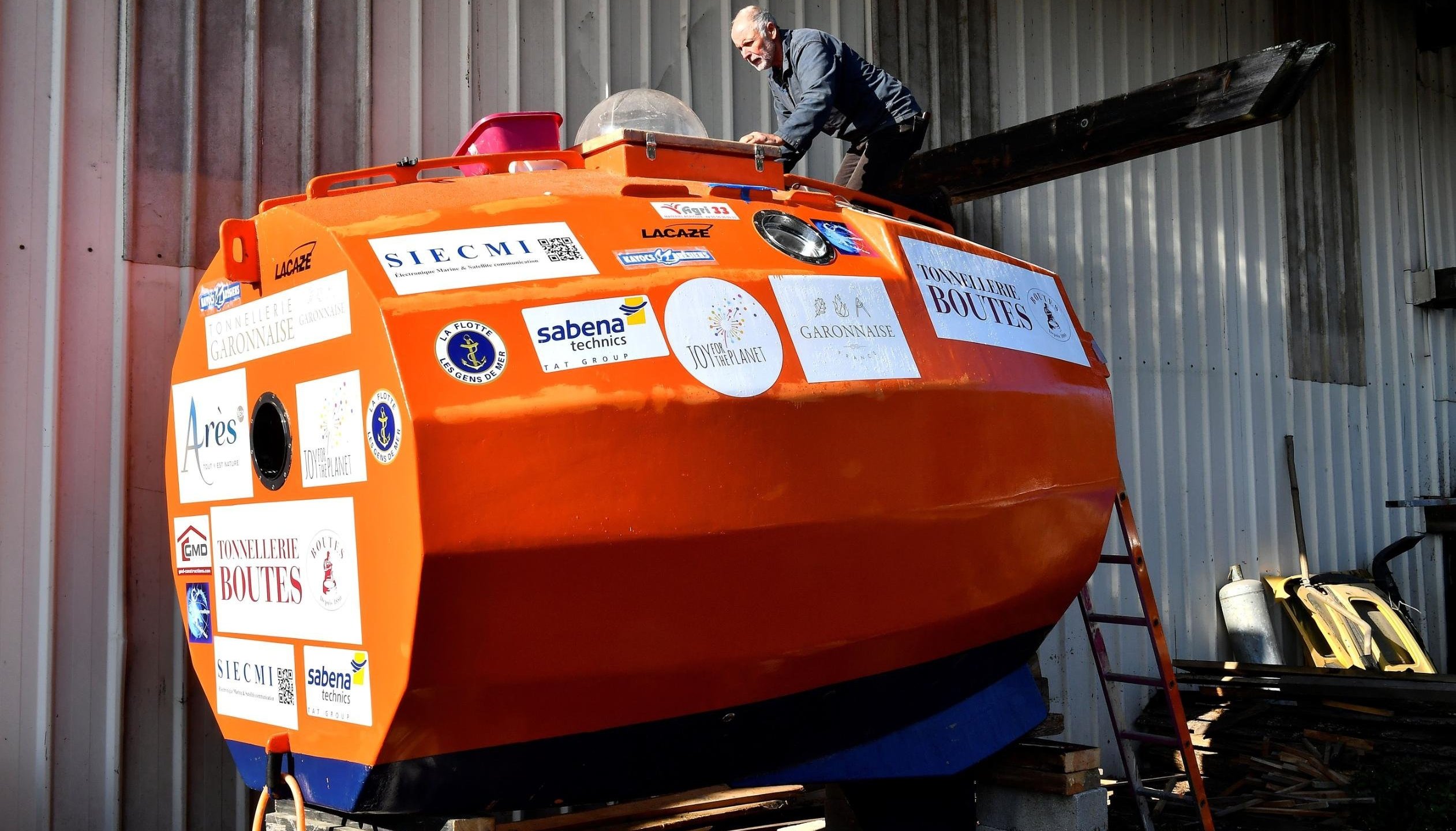 A 71-year-old Frenchman has set sail across the Atlantic Ocean in a large orange barrel in late December 2018, hoping to float to the Caribbean by the end of March 2019. (Credit: Georges Gobet/AFP/Getty Images via CNN)