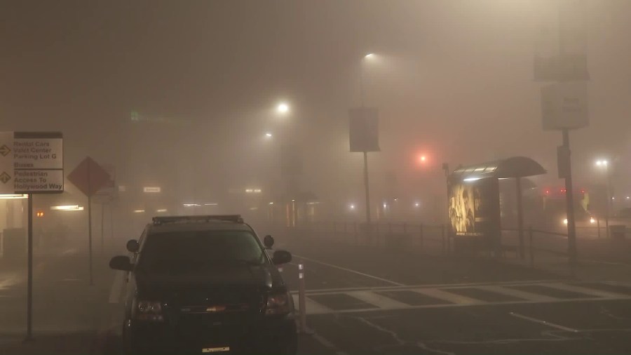 Dense fog is seen on a street in Burbank on Dec. 24, 2018. (Credit: KTLA)