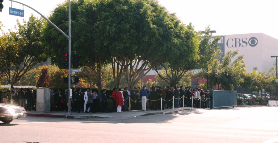 Participants wait in line outside CBS Television City for tryouts during the "Elvis" opening casting call on Oct. 10, 2004. (Credit: Frederick M. Brown / Getty Images)