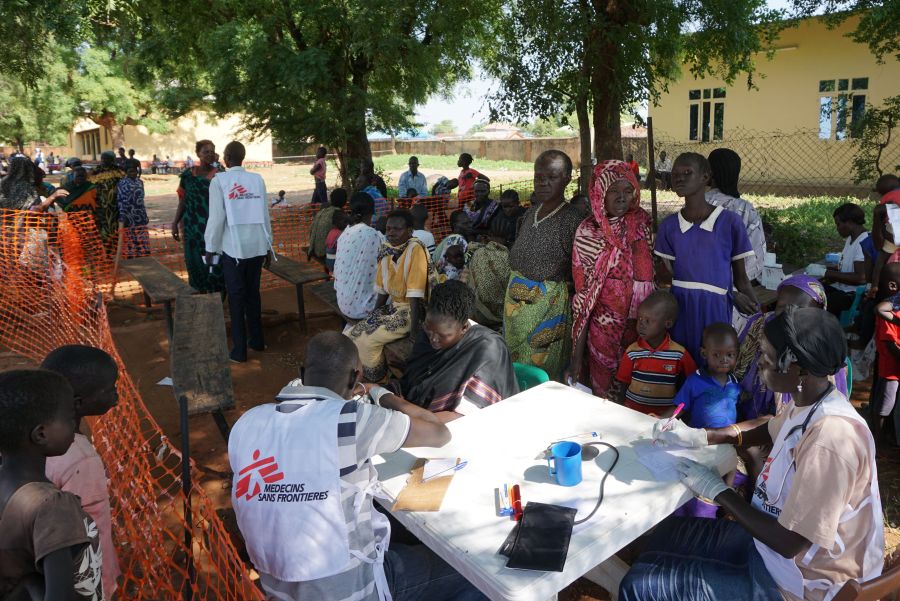 Medics from aid agency Doctors Without Borders (MSF) treat patients at a makeshift clinic in the grounds of the Catholic Cathedral in the South Sudanese capital Juba on July 15, 2016, after days of fighting left hundreds dead and forced thousands to flee their homes. (Credit: PETER MARTELL/AFP/Getty Images)