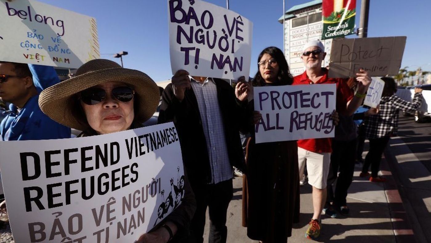 Fusako Takeda, 74, left, joins members of the Little Saigon community at a protest on Dec. 15, 2018 after the Trump administration said thousands of Vietnam War refugees who later committed crimes in the U.S. should not be protected from deportation. (Credit: Genaro Molina / Los Angeles Times)