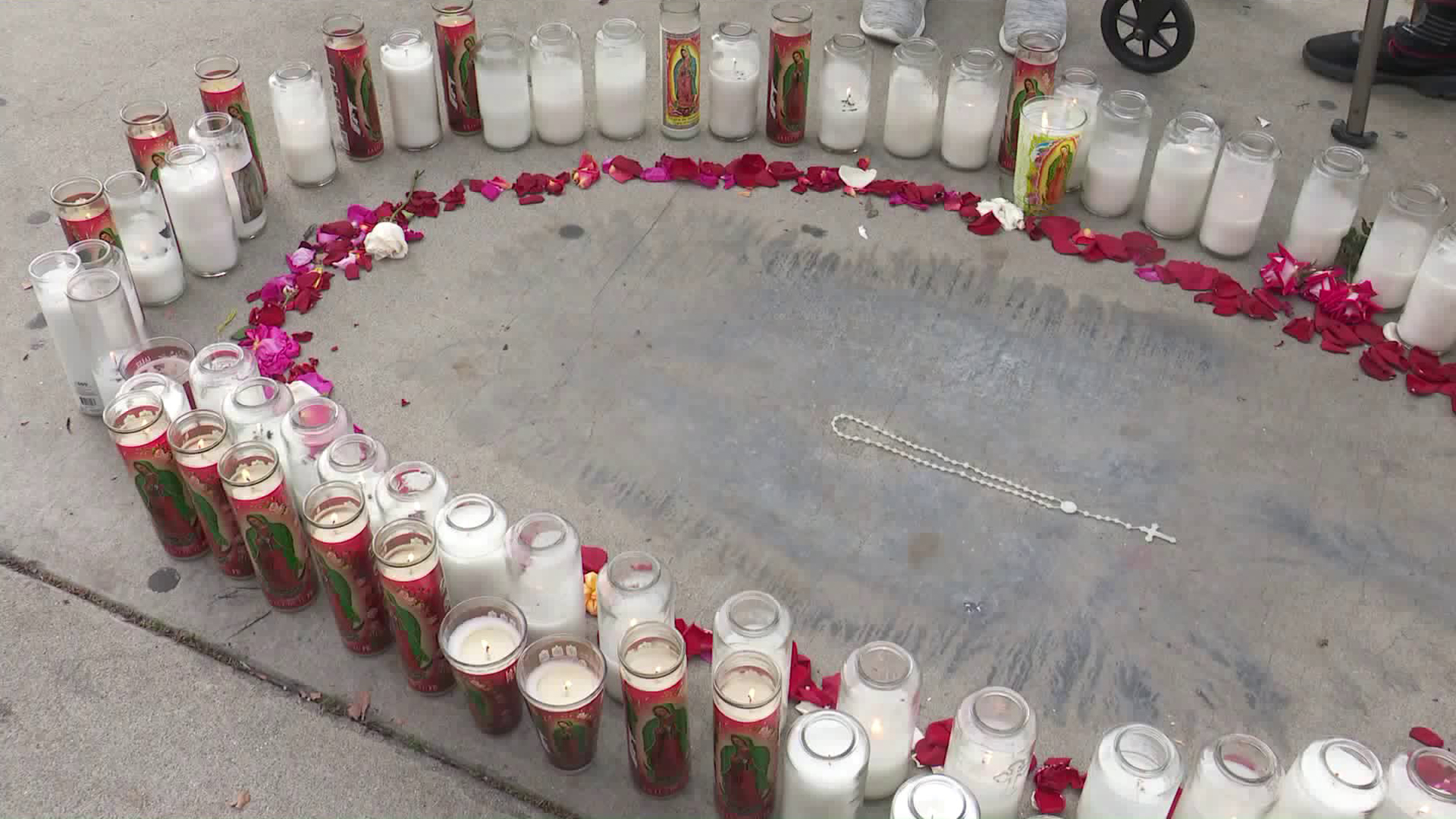 An unusual stain that bears a resemblance to the Virgin Mary is seen on a sidewalk in Artesia on Dec. 14, 2018. (Credit: KTLA)