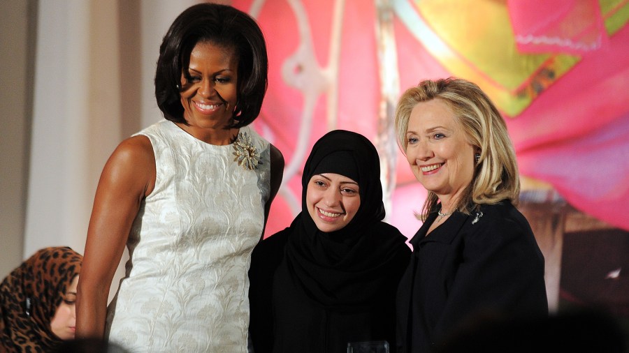 Samar Badawi appears in a photo alongside former First Lady Michelle Obama and former Secretary of State Hillary Clinton at the 2012 International Women of Courage Award ceremony in Washington, D.C., on March 8, 2012. (Credit: Jewel Samad/AFP/Getty Images)