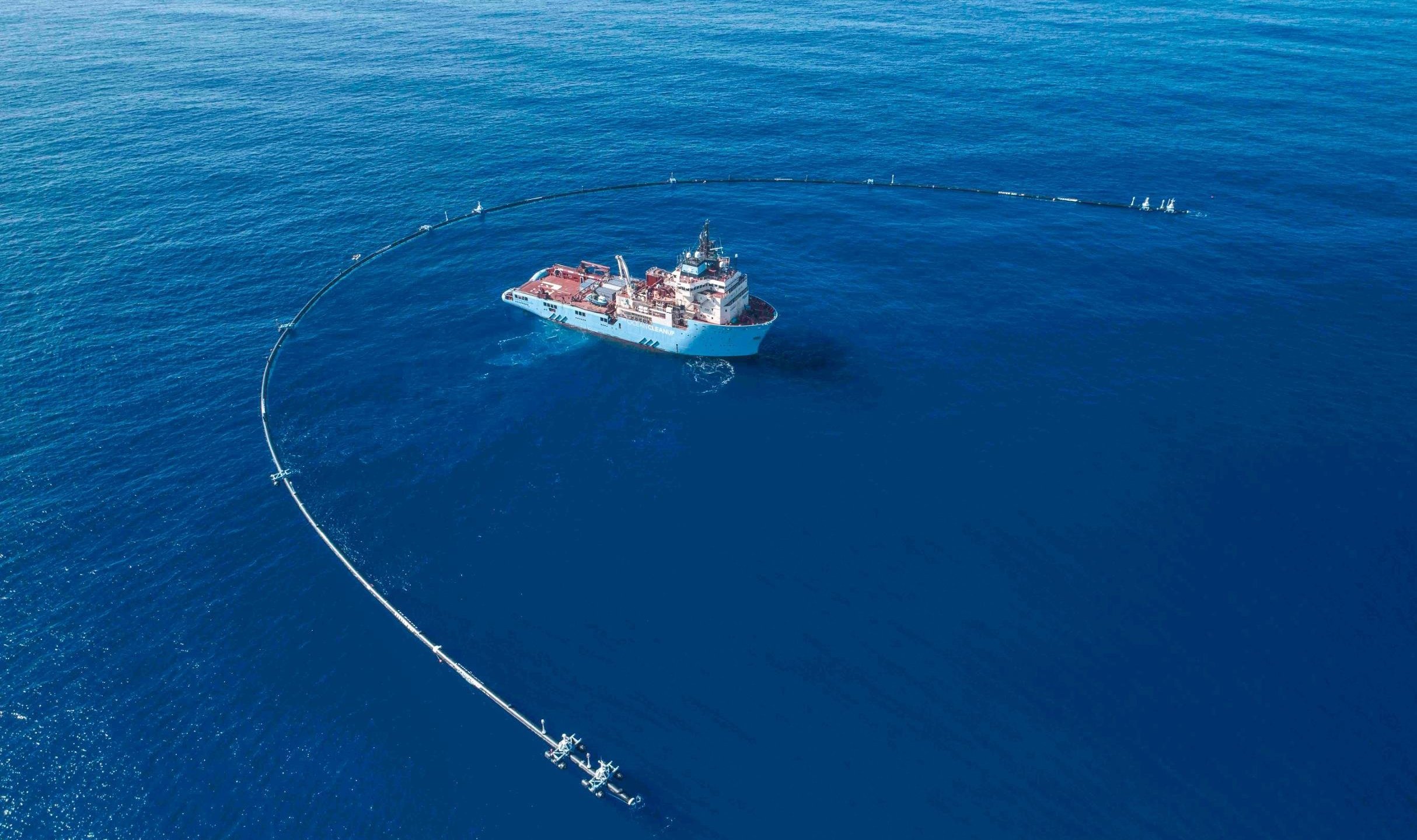 The 2,000-foot-long system created to clean up plastic pollution in the Pacific Ocean appears in an undated photo. (Credit: The Ocean Cleanup via CNN)