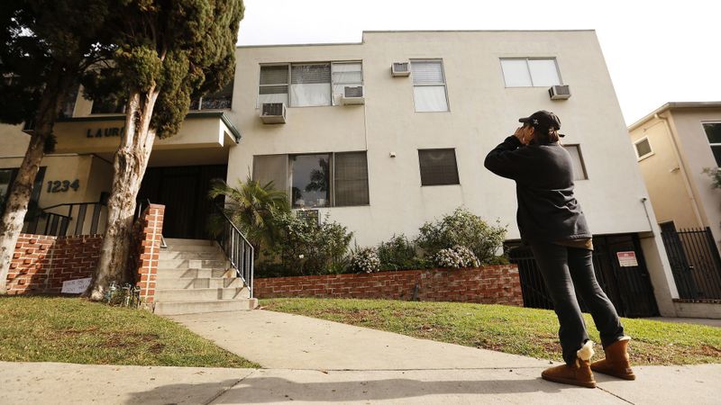 Jackie Tepper shouts toward the second-floor apartment of Ed Buck, a longtime Democratic political donor, onetime West Hollywood City Council candidate and a well-known figure in LGBTQ political circles in this undated photo. (Credit: Al Seib / Los Angeles Times)