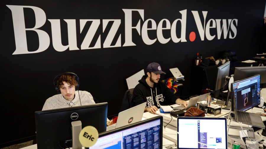 Members of the BuzzFeed News team work at their desks at BuzzFeed headquarters, Dec. 11, 2018, in New York City. BuzzFeed is an American internet media and news company that was founded in 2006. (Credit: Drew Angerer/Getty Images)