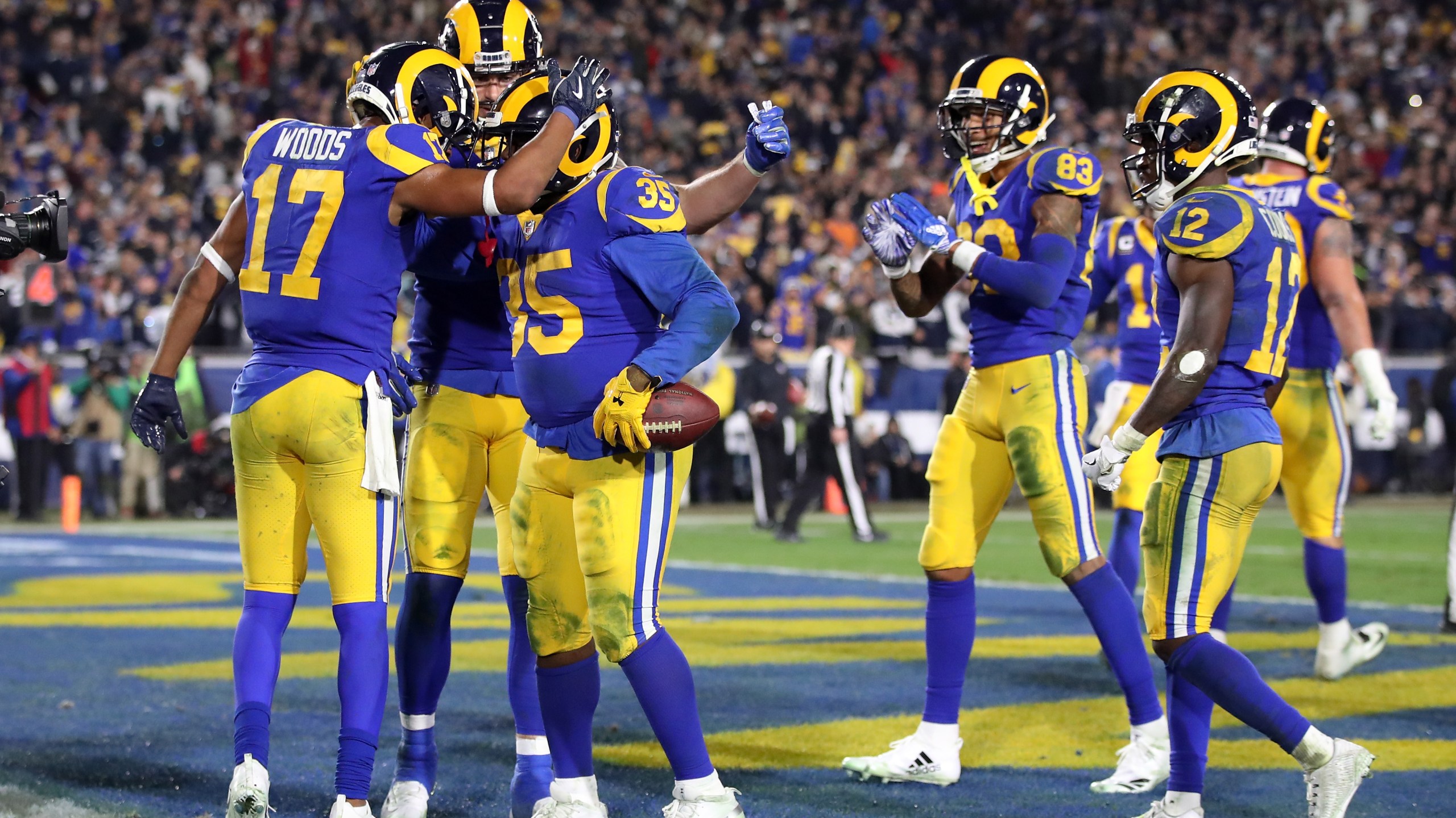 C.J. Anderson #35 of the Los Angeles Rams celebrates with teammates after a 1 yard touchdown run in the fourth quarter against the Dallas Cowboys in the NFC Divisional Playoff game at Los Angeles Memorial Coliseum on January 12, 2019 in Los Angeles, California. (Credit: Sean M. Haffey/Getty Images)