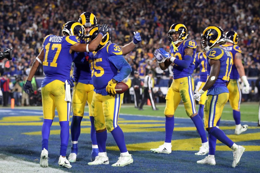 C.J. Anderson #35 of the Los Angeles Rams celebrates with teammates after a 1 yard touchdown run in the fourth quarter against the Dallas Cowboys in the NFC Divisional Playoff game at Los Angeles Memorial Coliseum on January 12, 2019 in Los Angeles, California. (Credit: Sean M. Haffey/Getty Images)