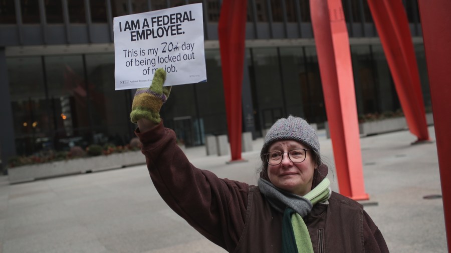 Kate Holtkamp, who works for the Food and Drug Administration joins other government workers protesting the government shutdown during a demonstration in the Federal Building Plaza on Jan. 10, 2019, in Chicago, Illinois. (Credit: Scott Olson/Getty Images)