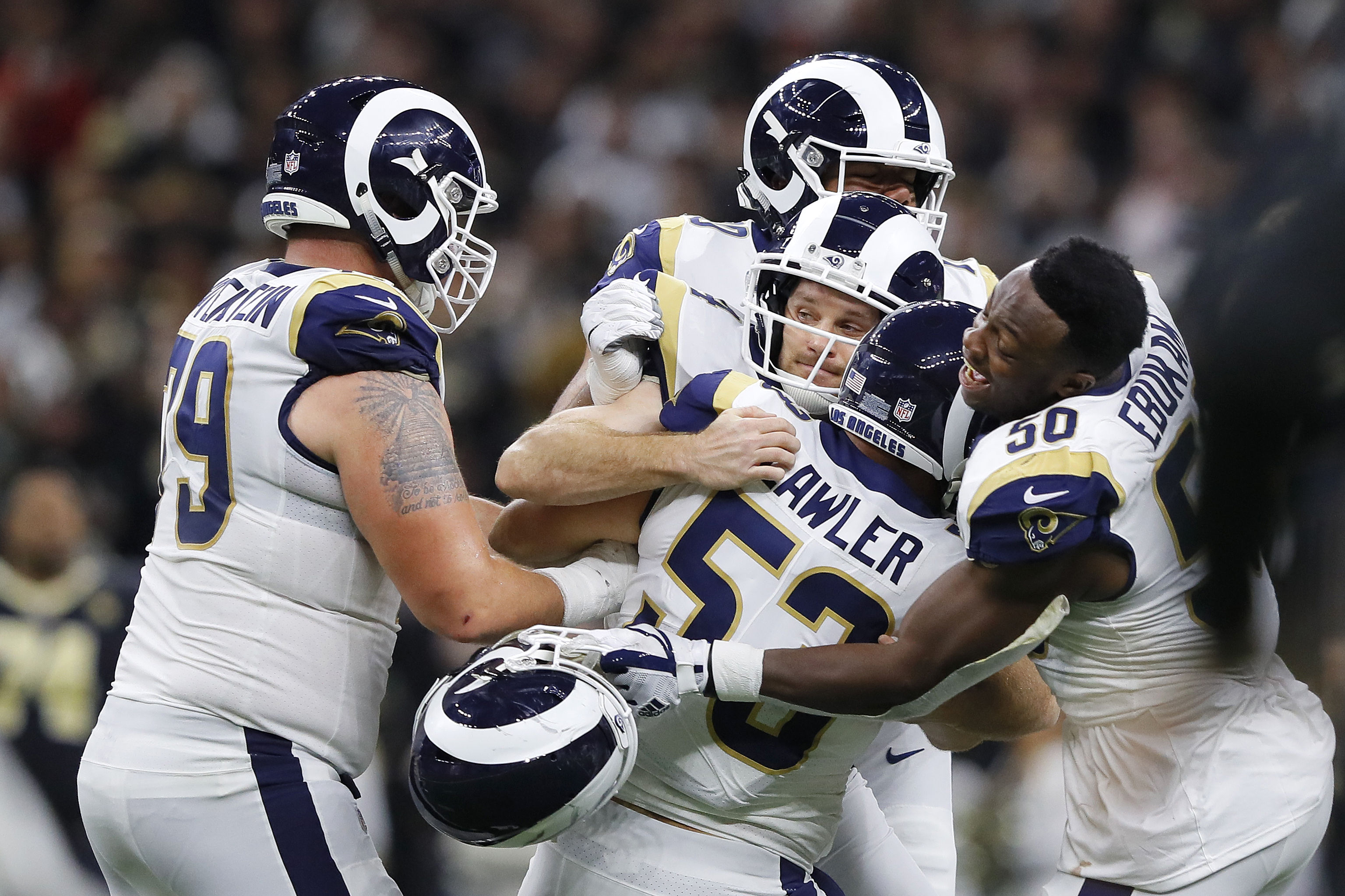 Johnny Hekker #6 and Greg Zuerlein #4 of the Los Angeles Rams celebrate after kicking the game winning field goal in overtime against the New Orleans Saints in the NFC Championship game at the Mercedes-Benz Superdome in New Orleans on Jan. 20, 2019. (Credit: Kevin C. Cox / Getty Images)