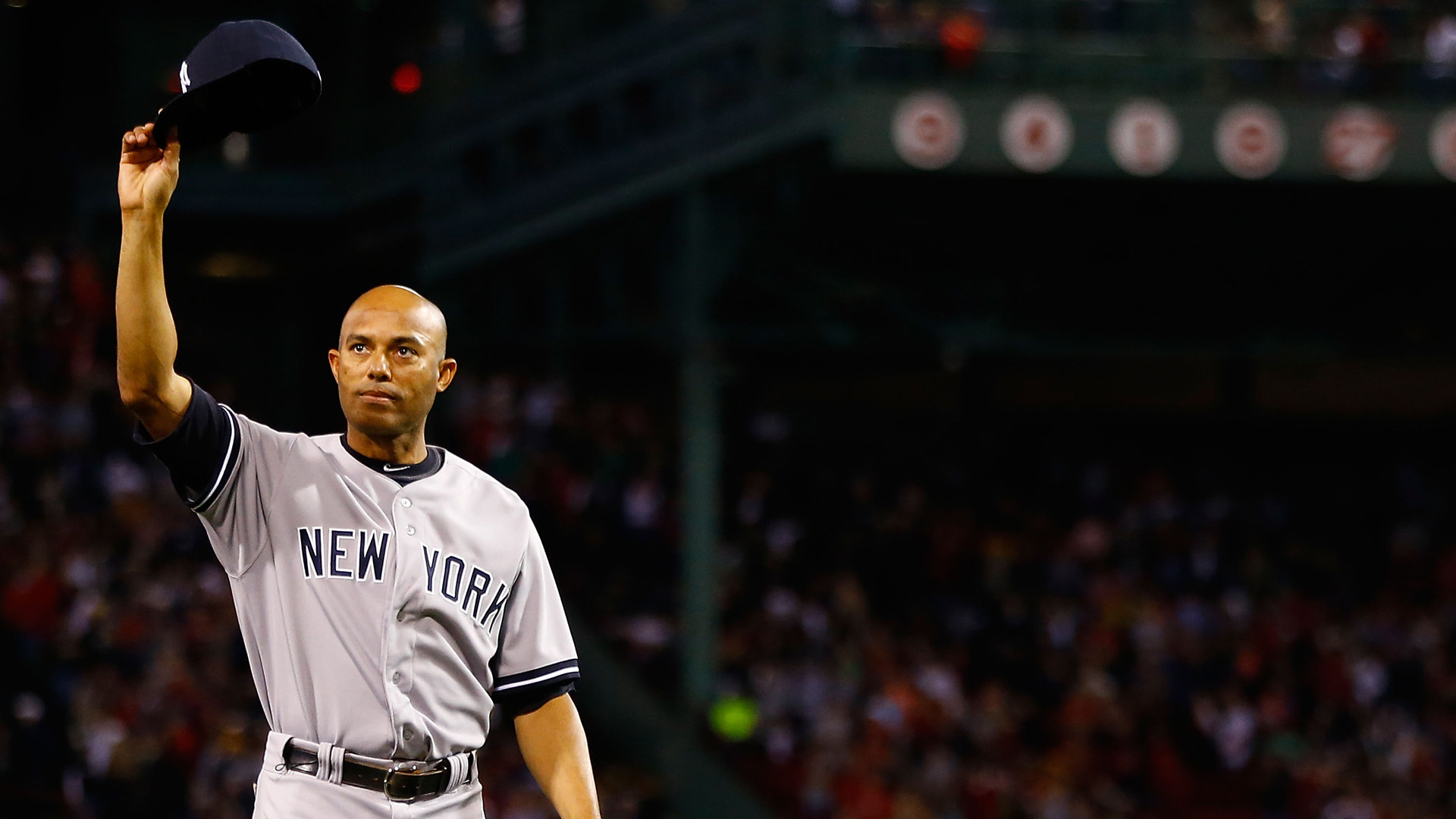 Mariano Rivera #42 of the New York Yankees tips his hat to the crowd after being honored prior to the game against the Boston Red Sox on September 15, 2013 at Fenway Park in Boston, Massachusetts. (Credit: Jared Wickerham/Getty Images)