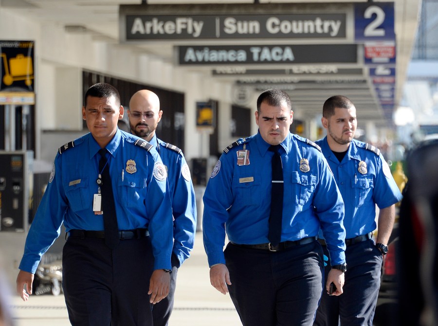 Transportation Security Administration agents walk on the departures level a day after a shooting that killed one Transportation Security Administration worker and injured several others at Los Angeles International Airport November 2, 2013 in Los Angeles, California.(Credit: Kevork Djansezian/Getty Images)