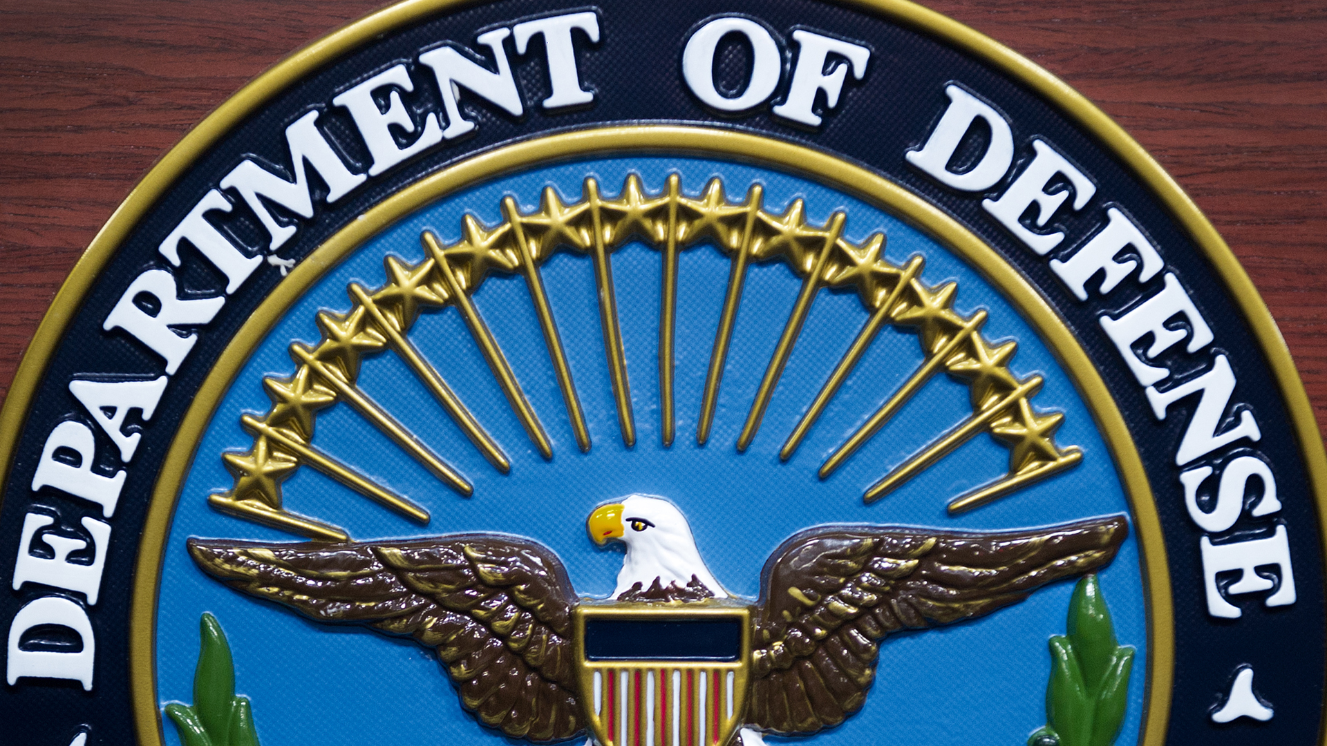 The U.S. Department of Defense seal is seen on the lectern in the media briefing room at the Pentagon Dec. 12, 2013, in Washington, D.C. (Credit: Paul J. Richards/AFP/Getty Images)