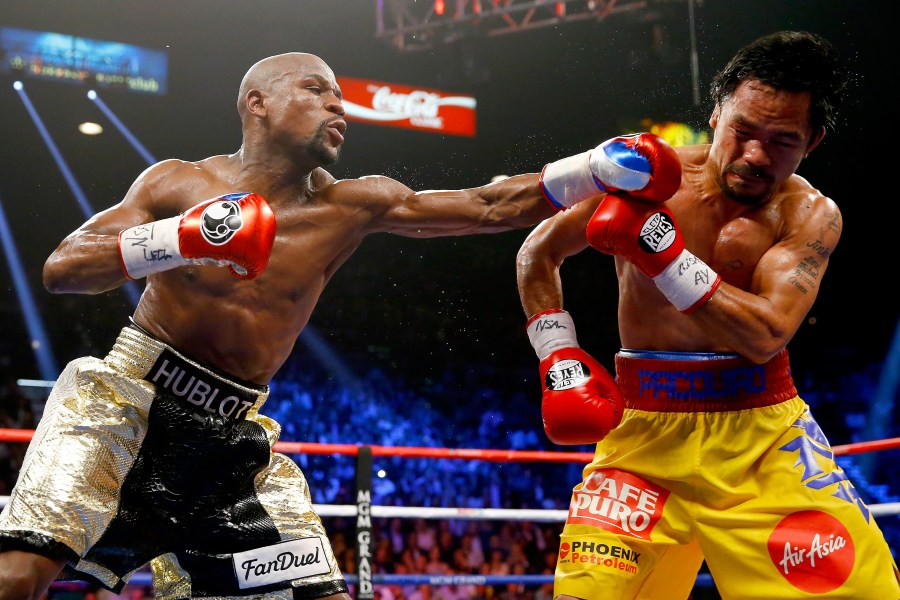 Floyd Mayweather Jr. throws a left at Manny Pacquiao during their welterweight unification championship bout on May 2, 2015 at MGM Grand Garden Arena in Las Vegas, Nevada. (Credit: Al Bello/Getty Images)