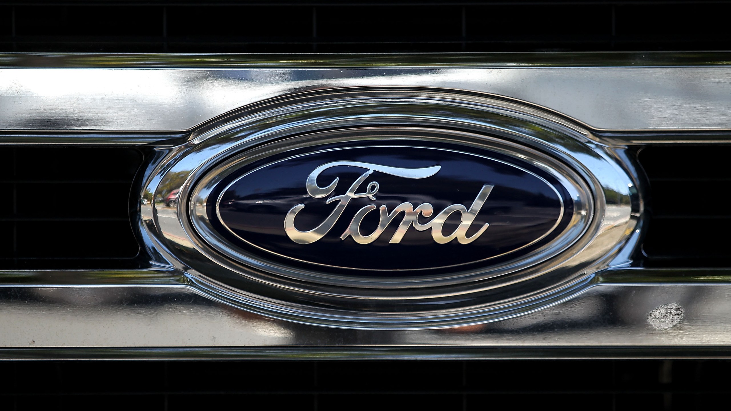 The Ford logo is displayed on the front of a brand new Ford truck at Serramonte Ford on July 28, 2015 in Colma. (Credit: Justin Sullivan/Getty Images)